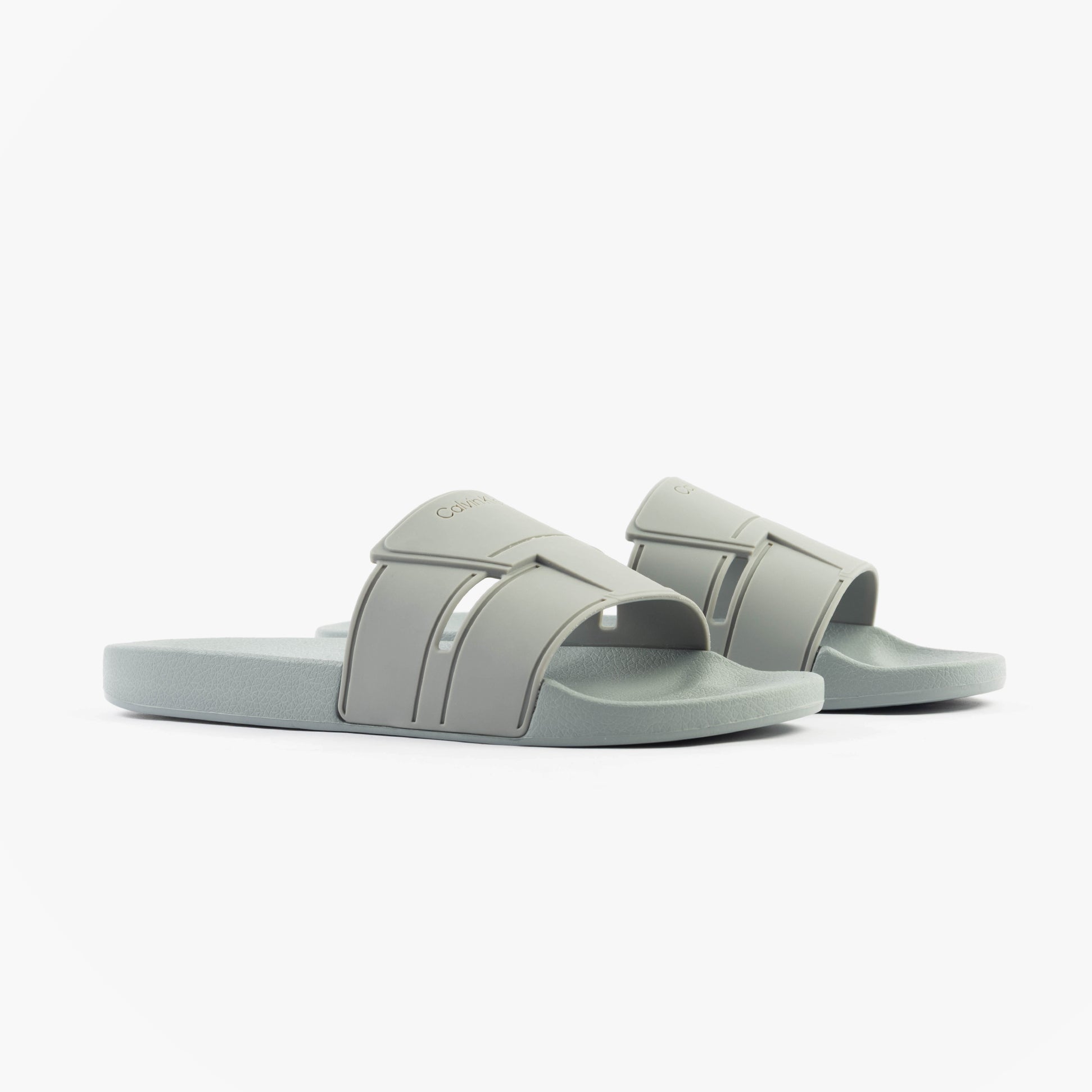 Calvin Klein POOL SLIDE DOUBLE T Mens Sliders Granite Road side view with grey synthetic upper and rubber sole.