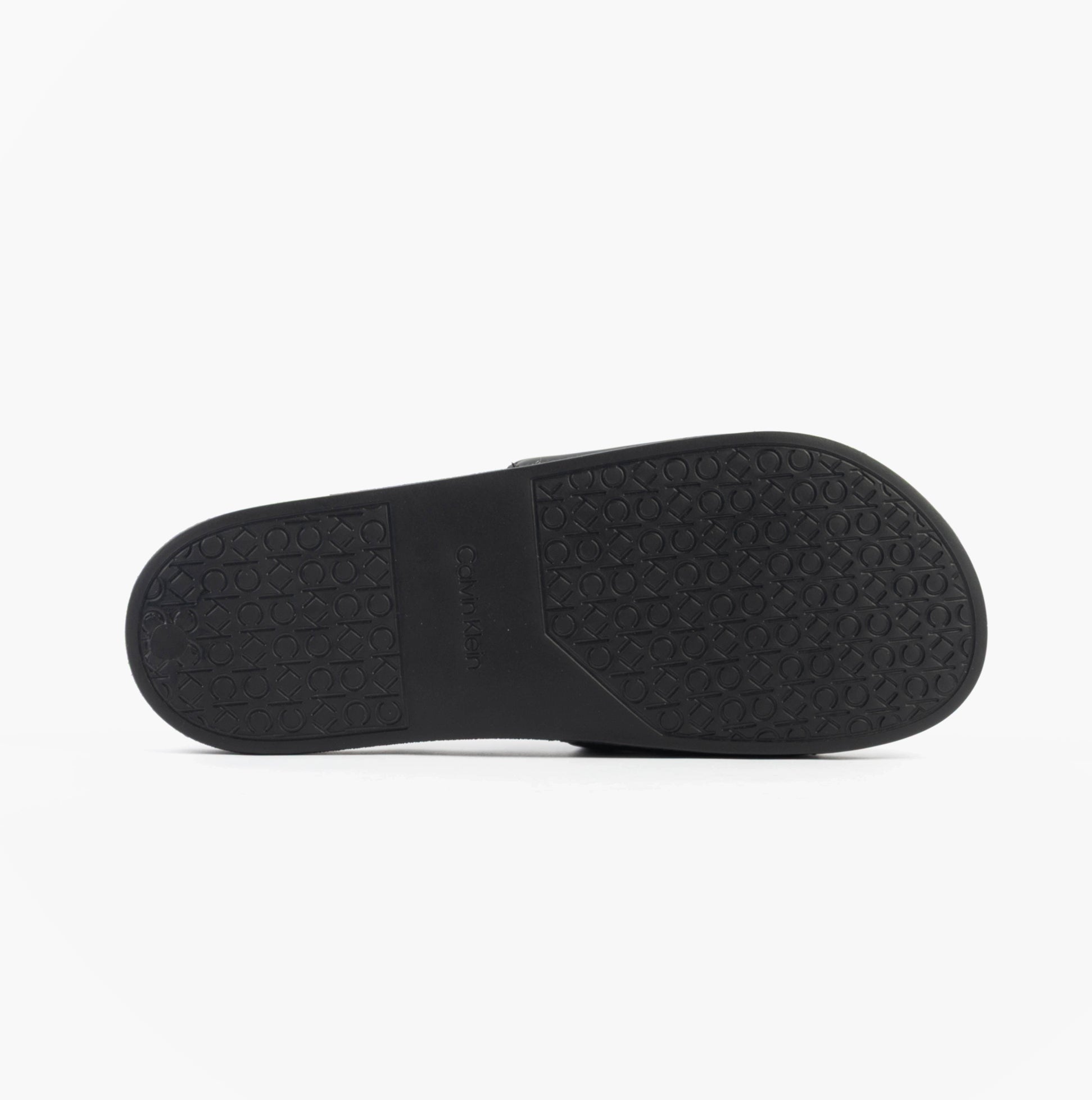 Calvin Klein POOL SLIDE W/ CK SQU Mens Sliders Black bottom view showcasing rubber sole with textured grip.