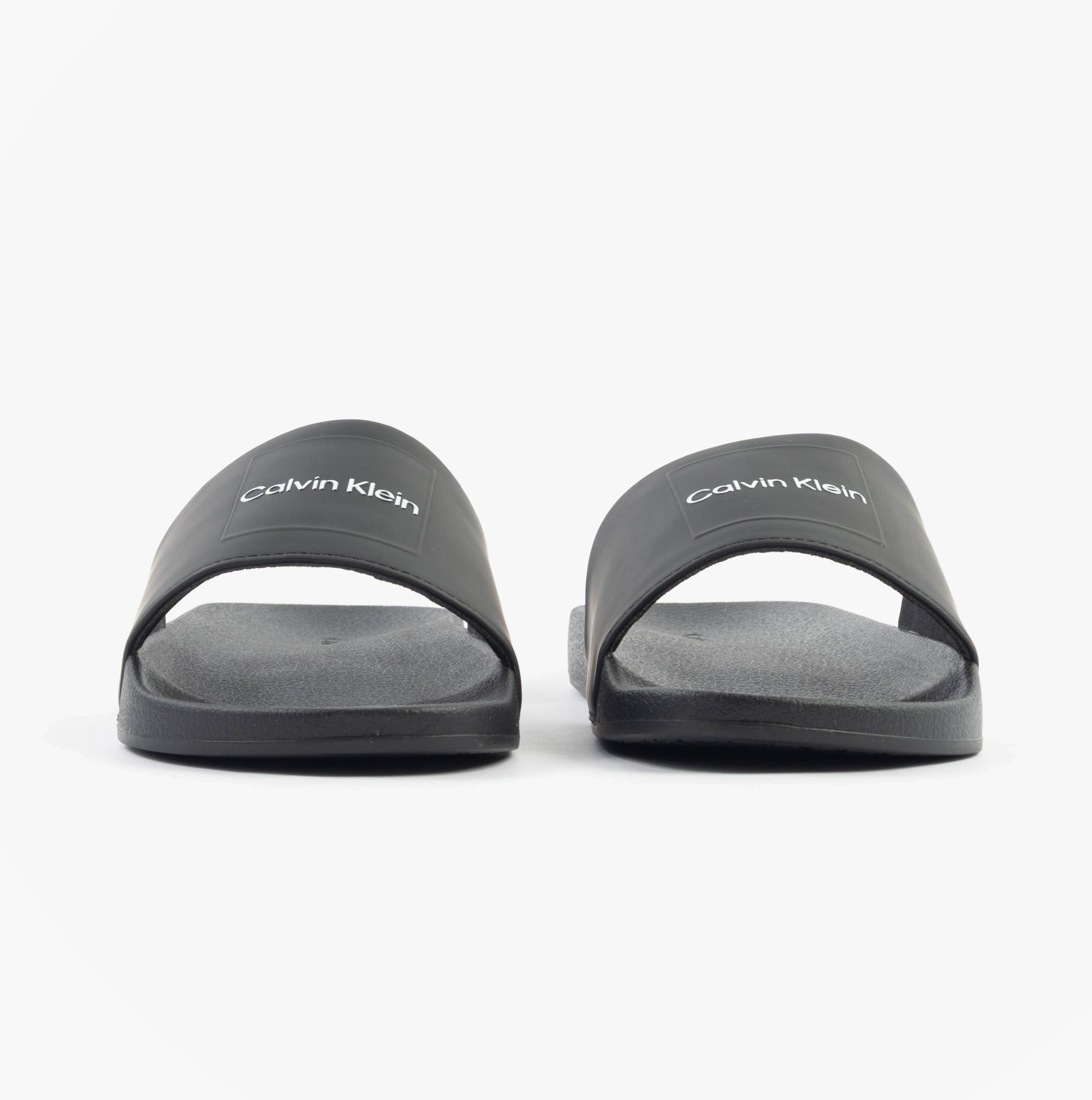 Calvin Klein POOL SLIDE W/ CK SQU Mens Sliders Black front view showcasing sleek design and logo.