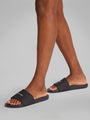 Calvin Klein POOL SLIDE W/ CK SQU Mens Sliders Black side view on model's feet showcasing comfort and style.