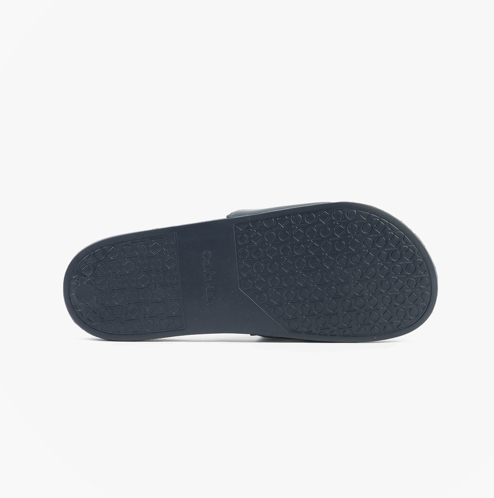 Calvin Klein POOL SLIDE W/ CK SQU Mens Sliders Calvin Navy, bottom view showing rubber sole pattern.