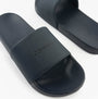 Calvin Klein POOL SLIDE W/ CK SQU Mens Sliders Calvin Navy side view showing synthetic upper and rubber sole.