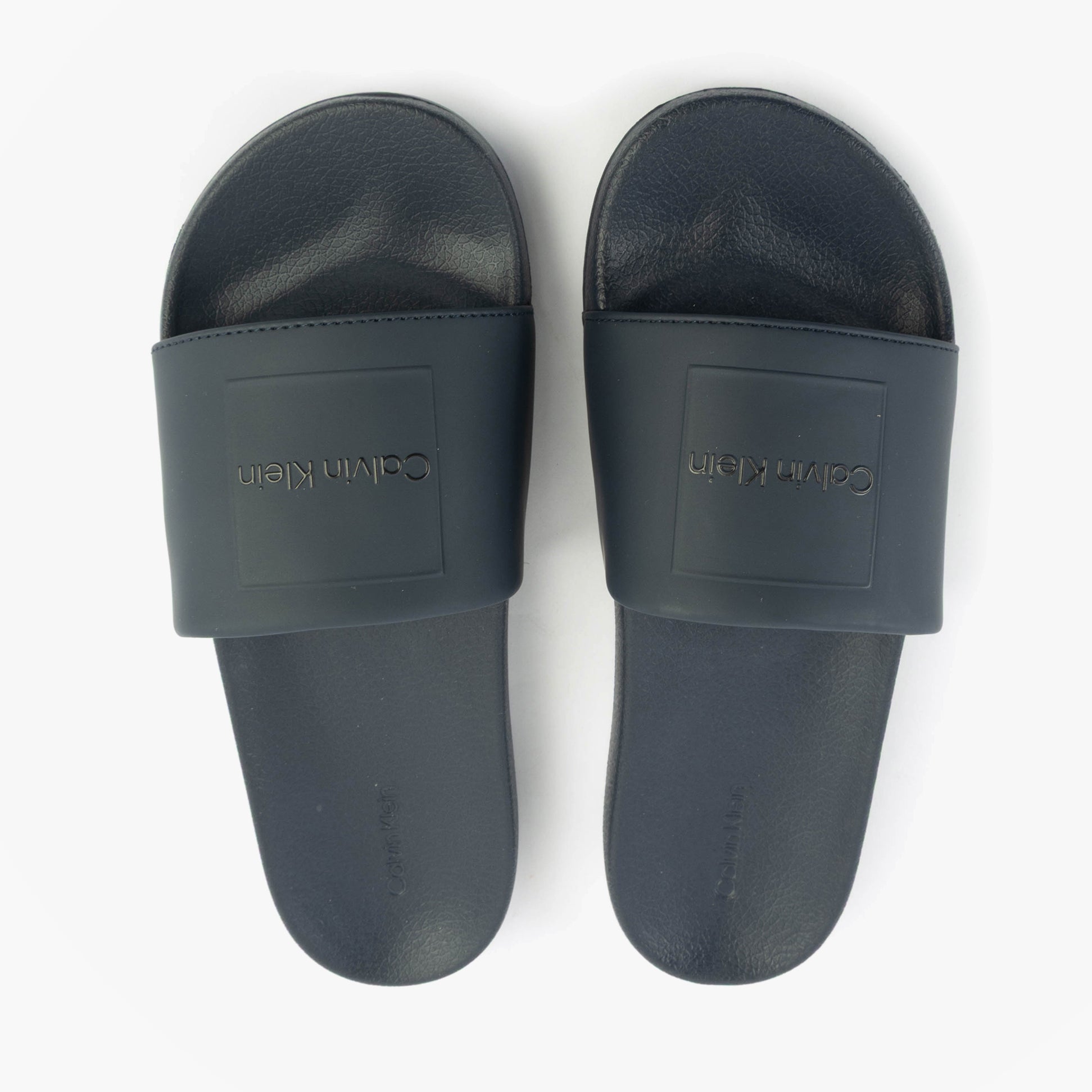 Calvin Klein POOL SLIDE W/ CK SQU Mens Sliders Calvin Navy top view showing flat and lightweight design.