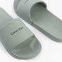 Calvin Klein POOL SLIDE W/ CK SQU Mens Sliders Granite Road side view showing light gray synthetic upper and slip-on design.