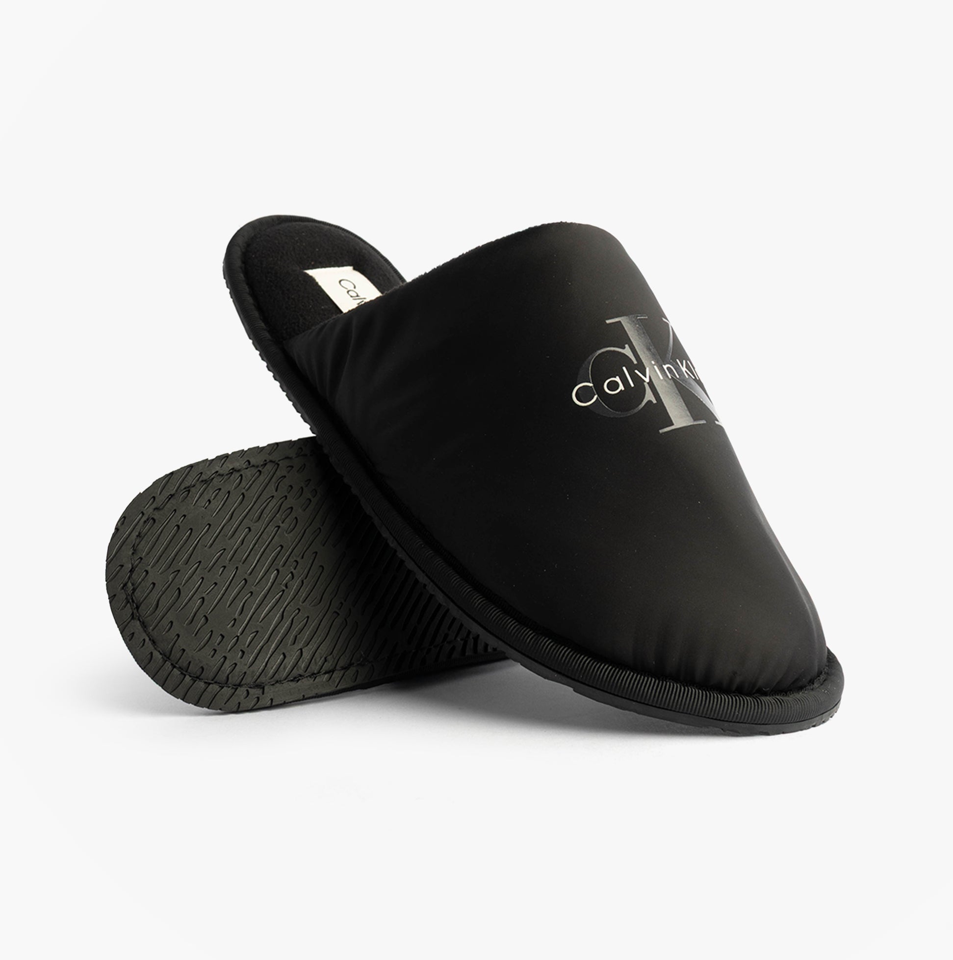 Calvin Klein HOTEL SLIPPER MONOLOGUE Mens Slippers Triple Black side view with logo on upper and sole detail.