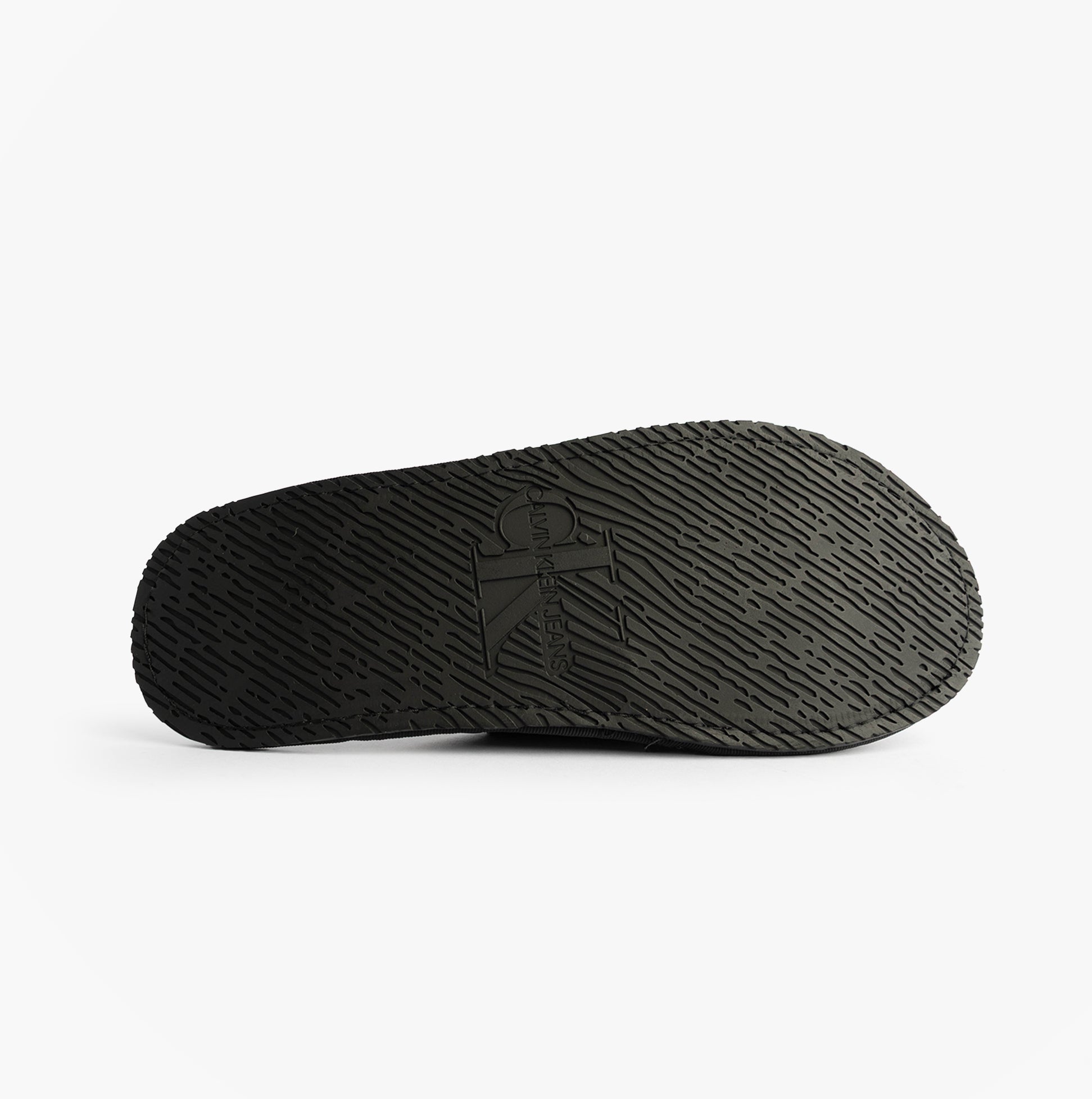 Calvin Klein HOTEL SLIPPER MONOLOGUE Mens Slippers Triple Black, underside view showcasing TPR sole design.