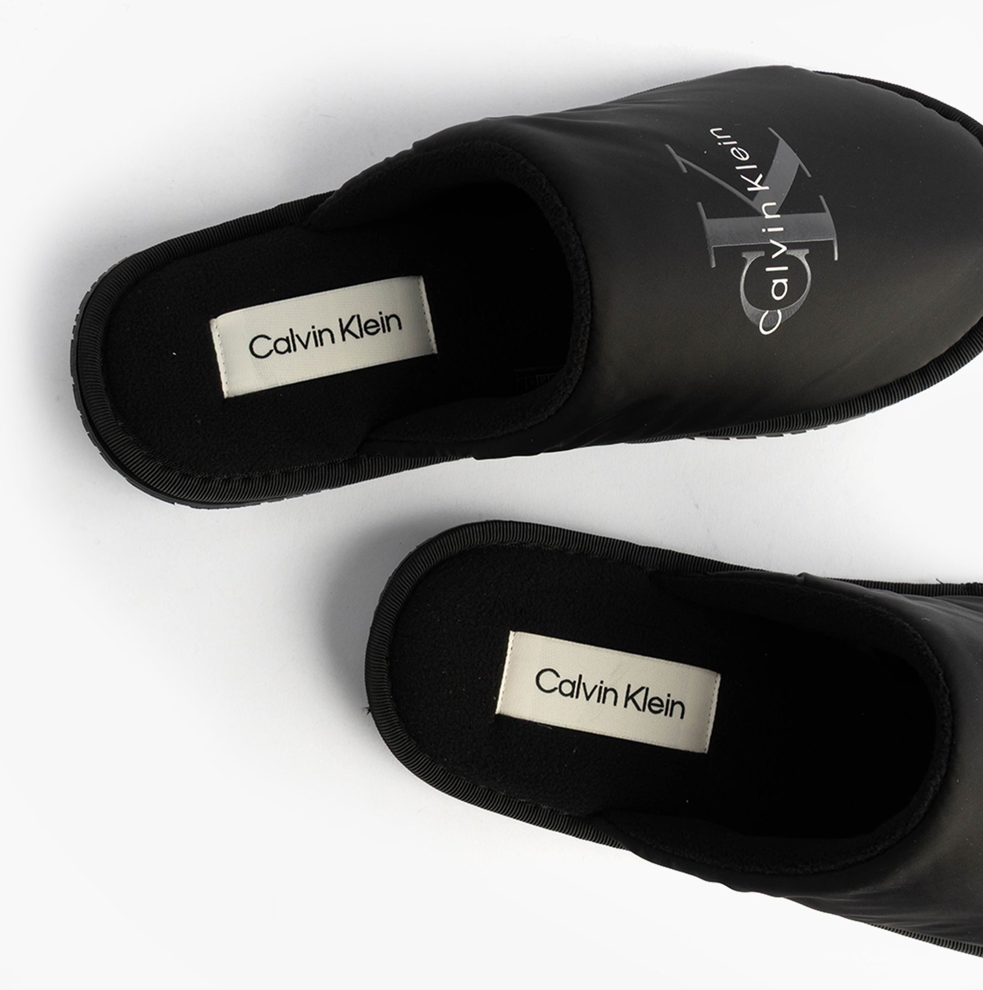 Calvin Klein HOTEL SLIPPER MONOLOGUE Mens Slippers Triple Black top view showing soft polyester upper and logo details.