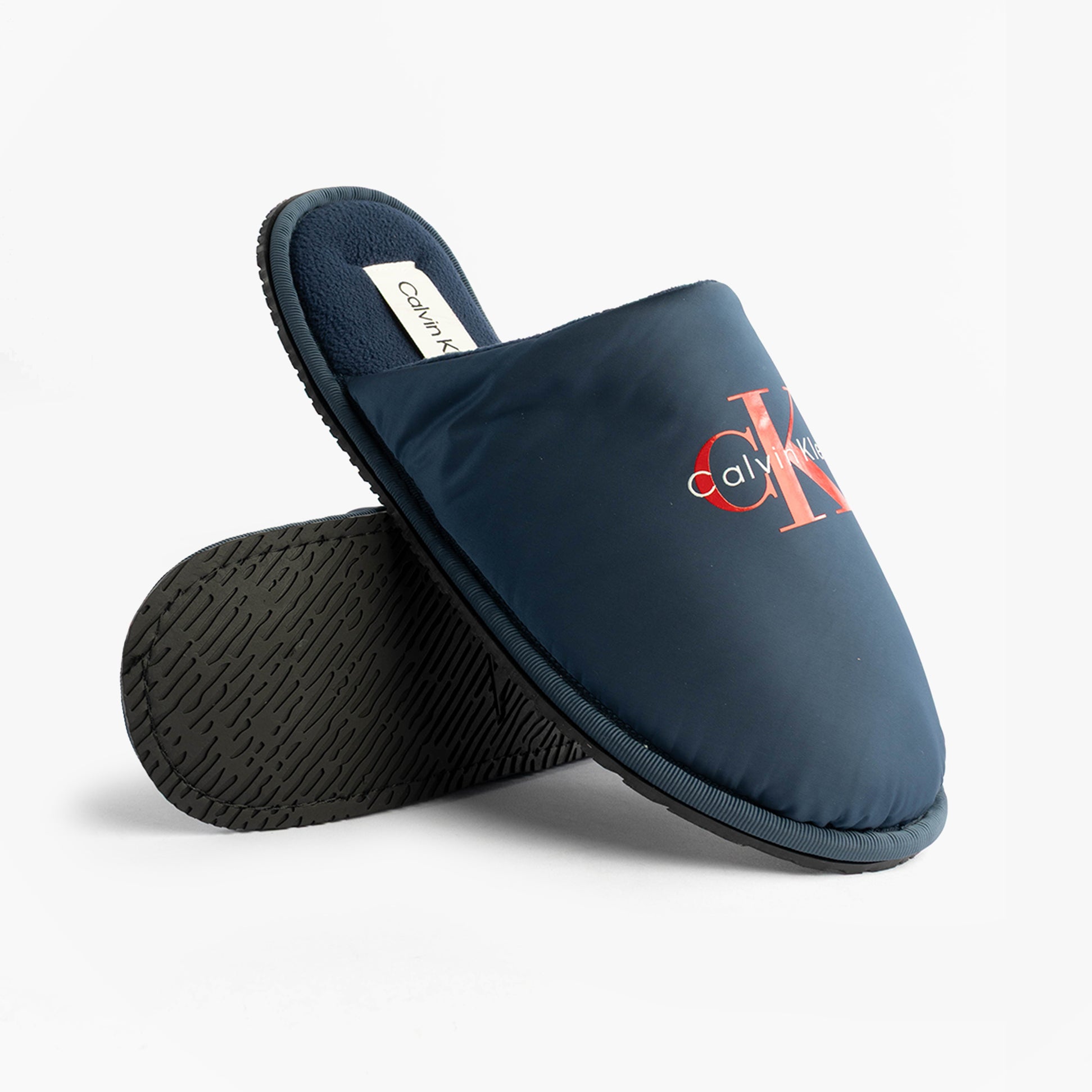 Calvin Klein HOTEL SLIPPER MONOLOGUE Mens Slippers Moonlit Ocean side view showing stylish slip-on design and textured sole.