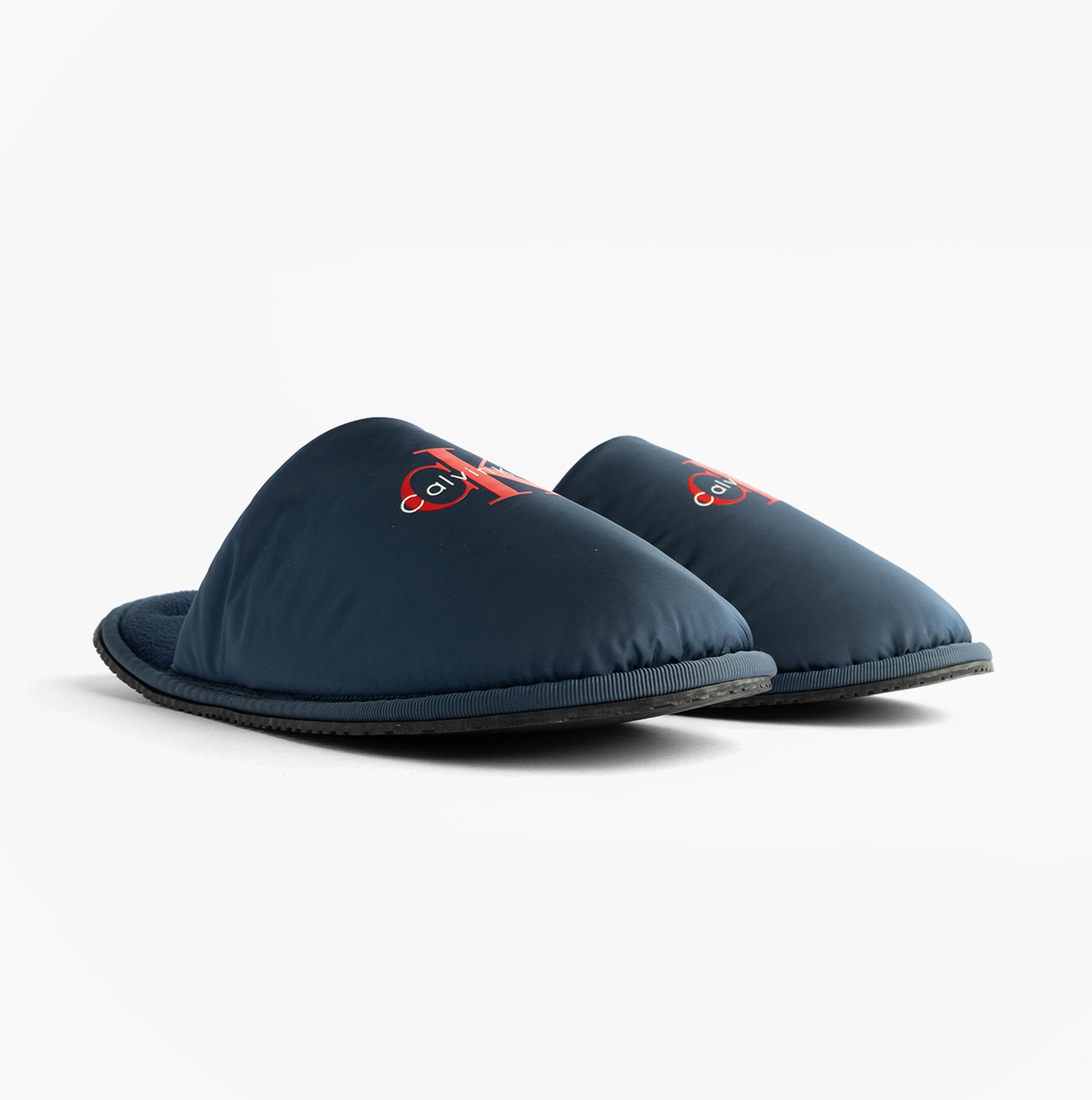 Calvin Klein HOTEL SLIPPER MONOLOGUE Mens Slippers Moonlit Ocean side view displaying mules with soft upper material.