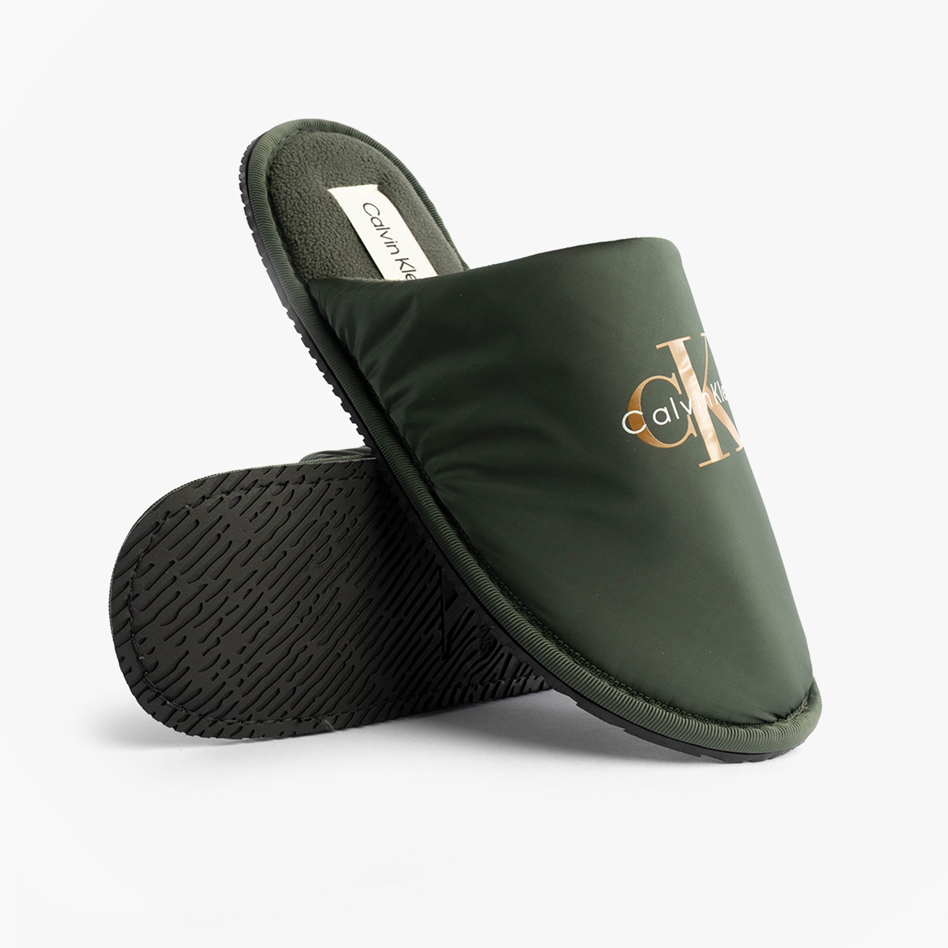 Calvin Klein HOTEL SLIPPER MONOLOGUE Mens Slippers Thyme, side view showing the lightweight green mules with logo.