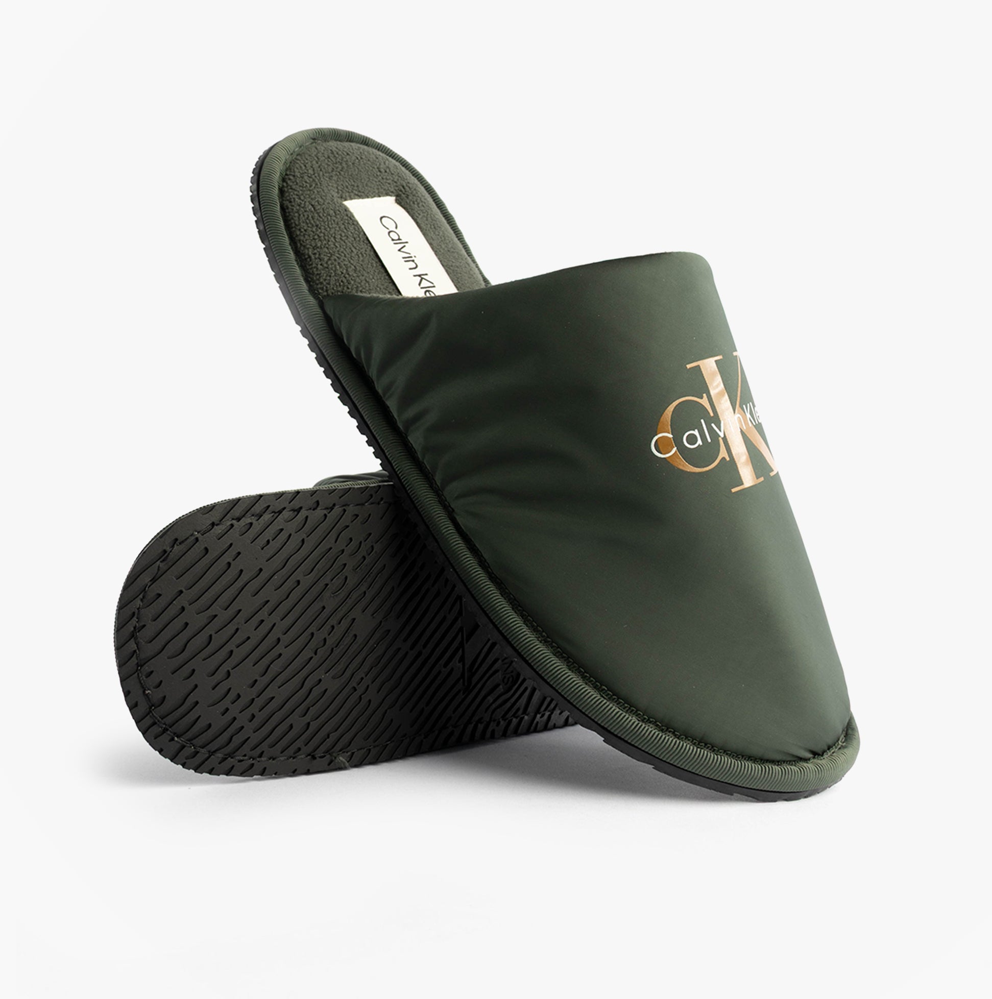 Calvin Klein HOTEL SLIPPER MONOLOGUE Mens Slippers Thyme, side view showing the lightweight green mules with logo.