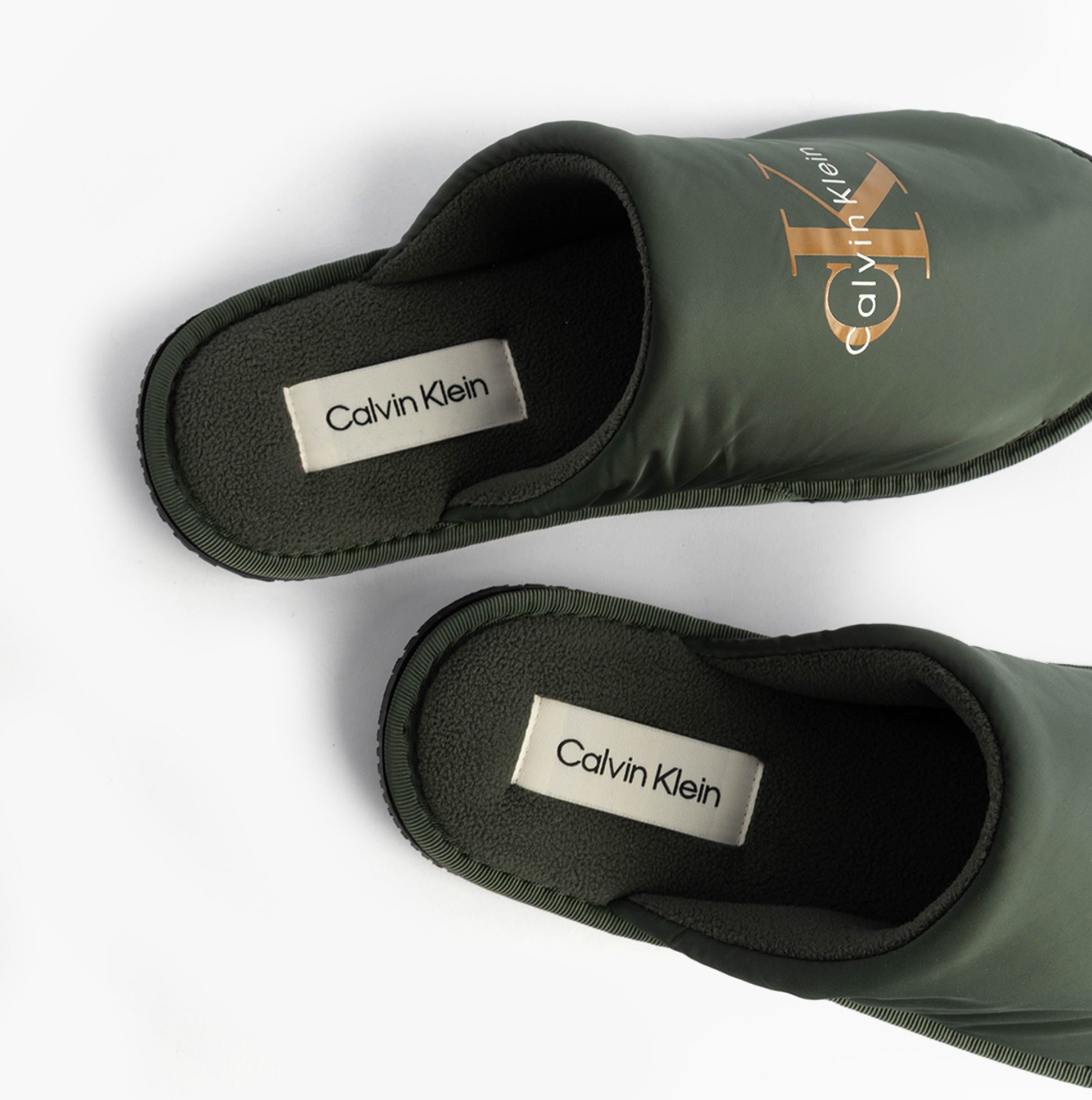 Calvin Klein HOTEL SLIPPER MONOLOGUE Mens Slippers Thyme top view showing soft green polyester mules with logo.