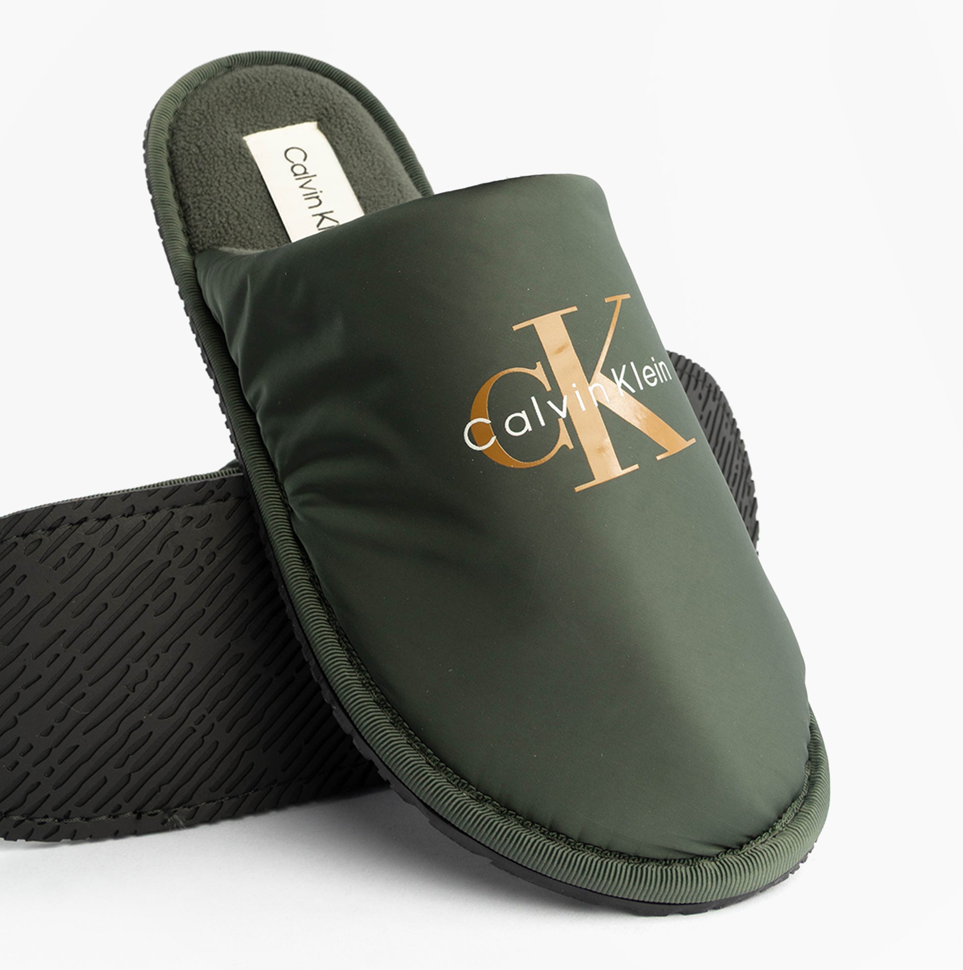 Calvin Klein HOTEL SLIPPER MONOLOGUE Mens Slippers Thyme side view showing lightweight slip-on design in green.