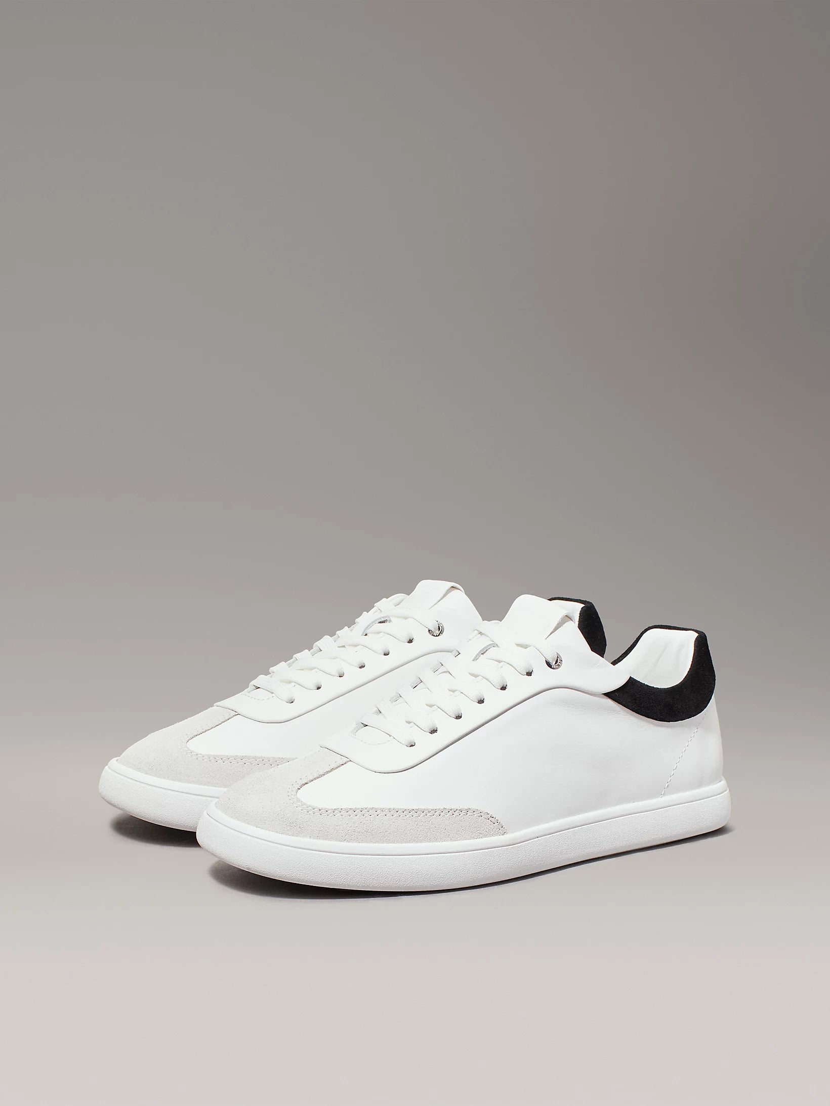 Calvin Klein CUPSOLE LACE UP Womens Trainers Bright White/Black side view showing sleek design and lace-up closure.