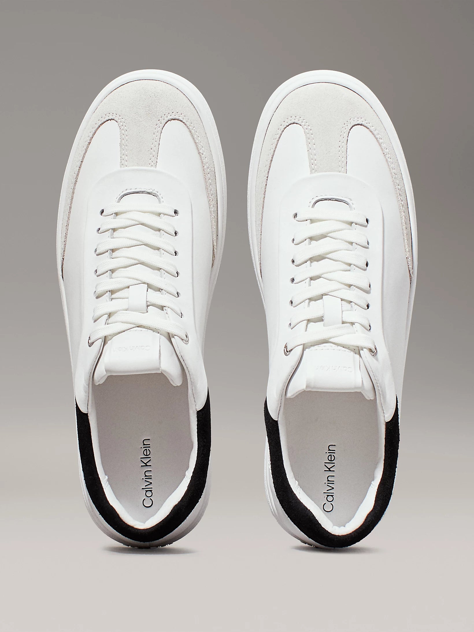 Calvin Klein CUPSOLE LACE UP Womens Trainers Bright White/Black top view showcasing soft leather and lace-up closure.