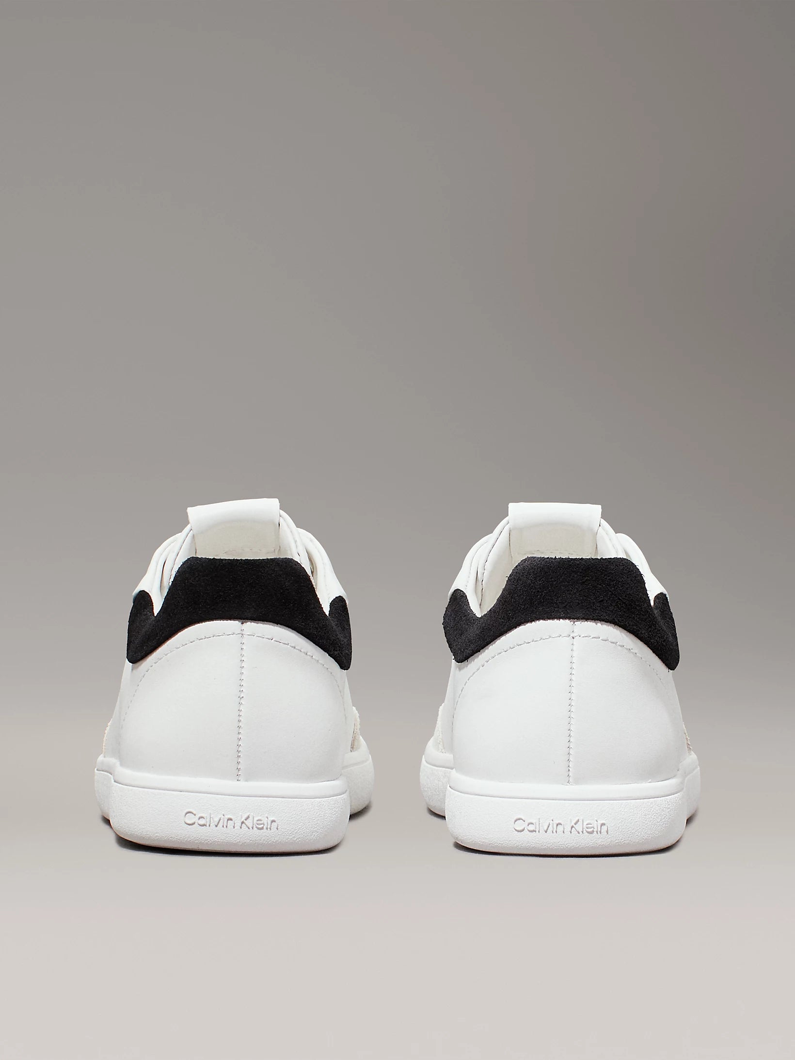 Calvin Klein CUPSOLE LACE UP Womens Trainers Bright White/Black rear view showcasing low top design and contrasting black detail.