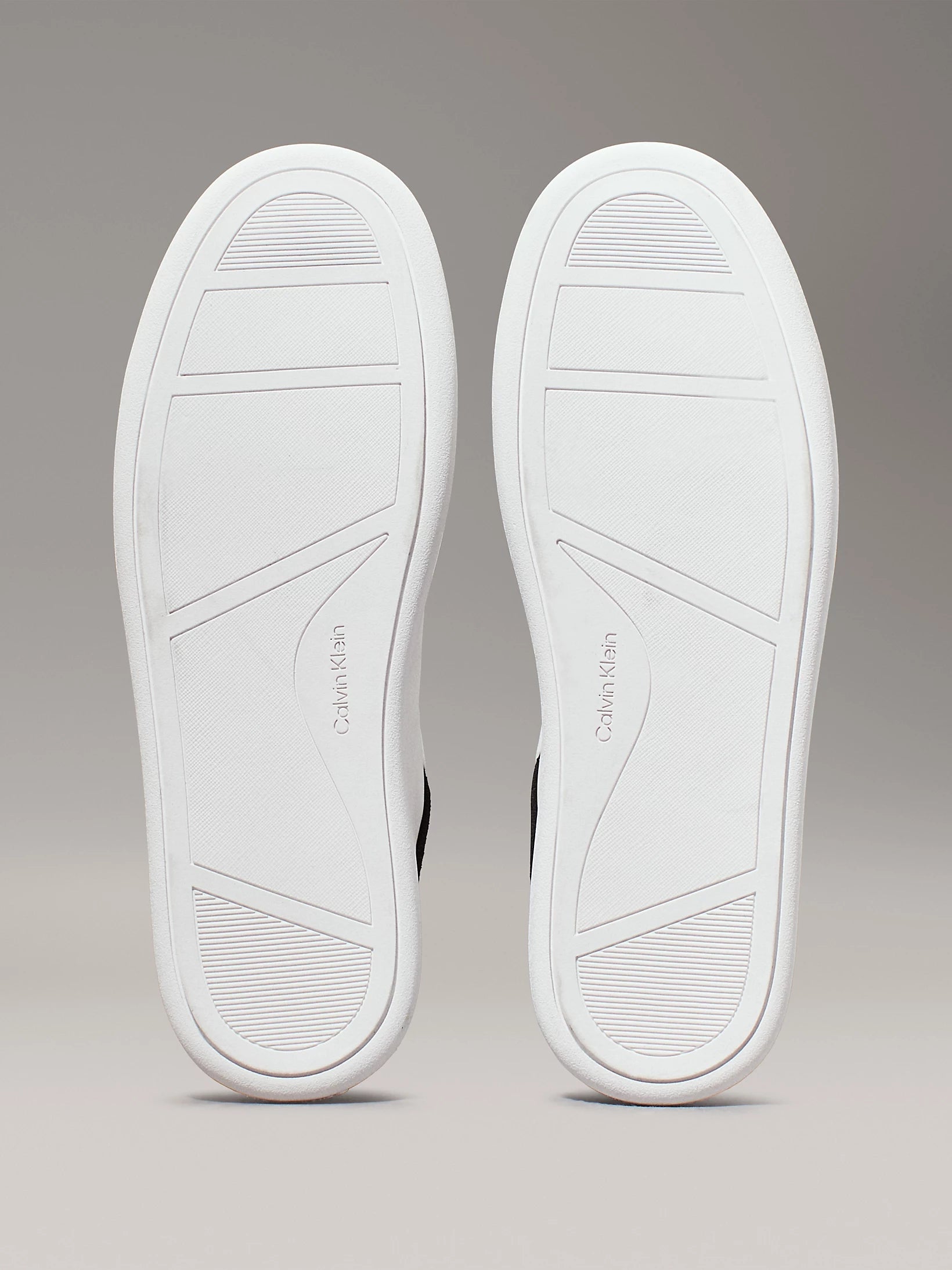 Calvin Klein CUPSOLE LACE UP Womens Trainers Bright White/Black bottom view, showcasing the rubber sole design.