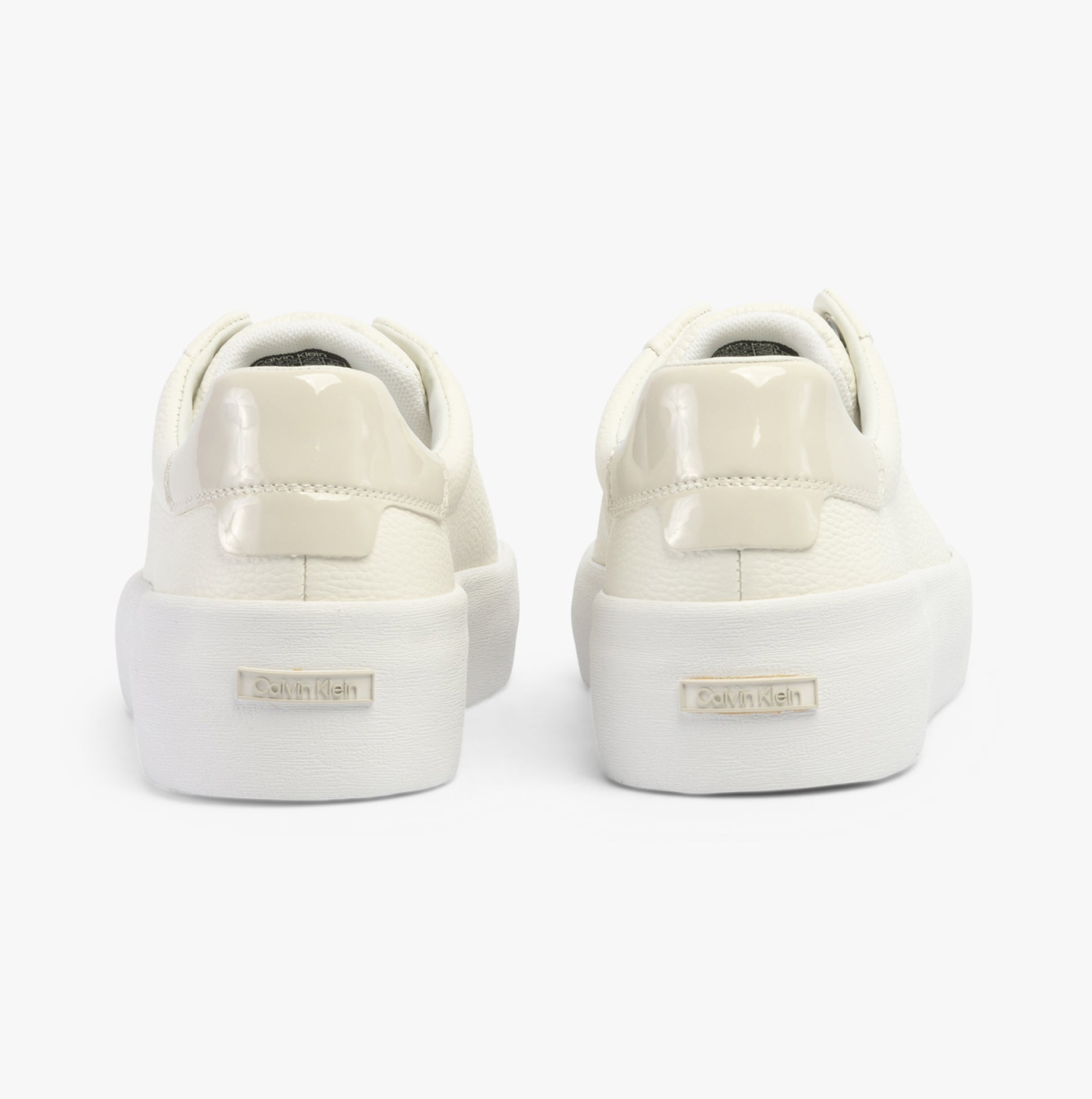 Calvin Klein VULCANISED LACE UP Womens Trainers White/Dk Ecru back view showcasing stylish low-top design.