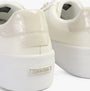 Calvin Klein VULCANISED LACE UP Womens Trainers White/Dk Ecru rear view highlighting the shiny heel and brand logo.