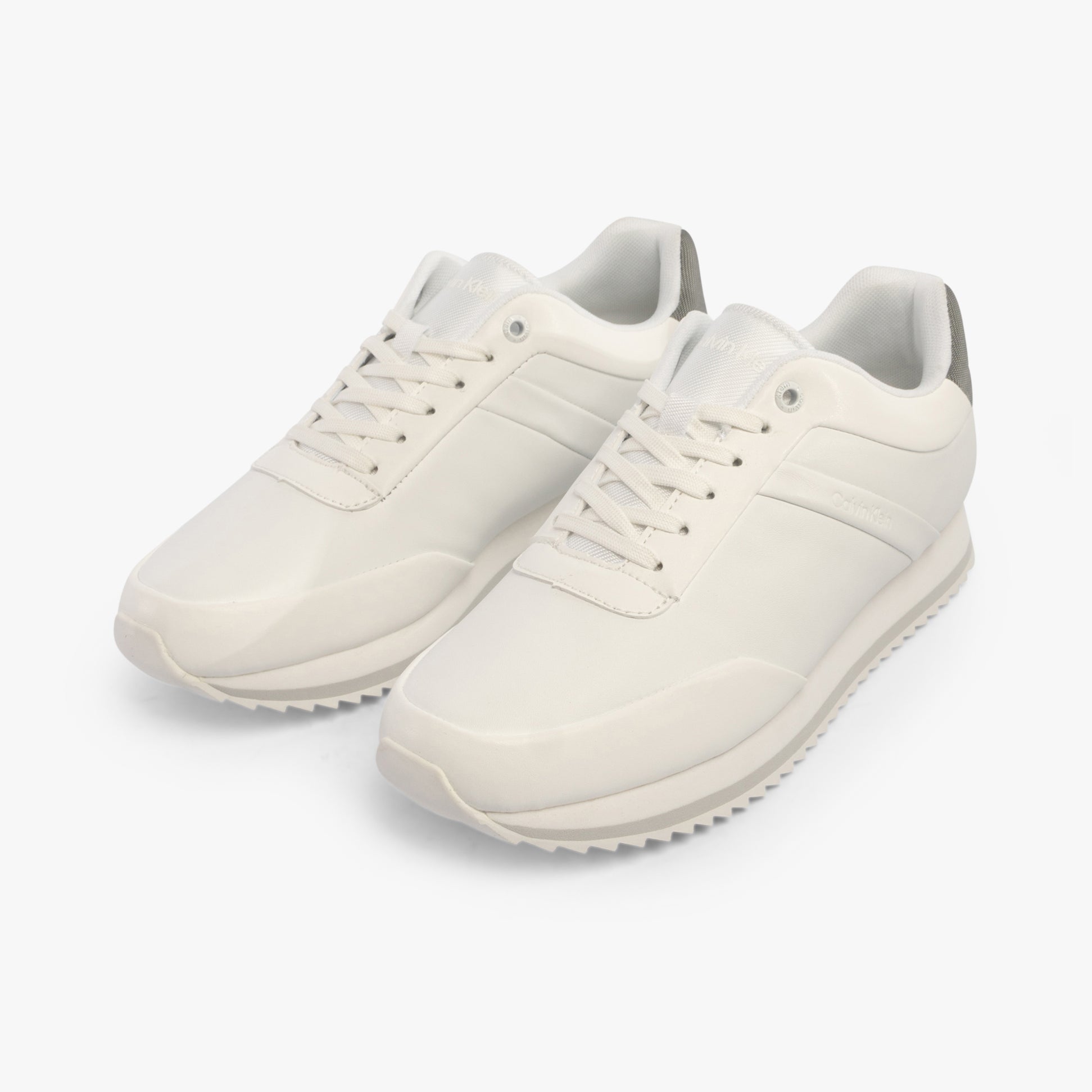 Calvin Klein RUNNER LACE UP Womens Trainers White/Neutral Gray side view showing lace-up closure and sleek design.