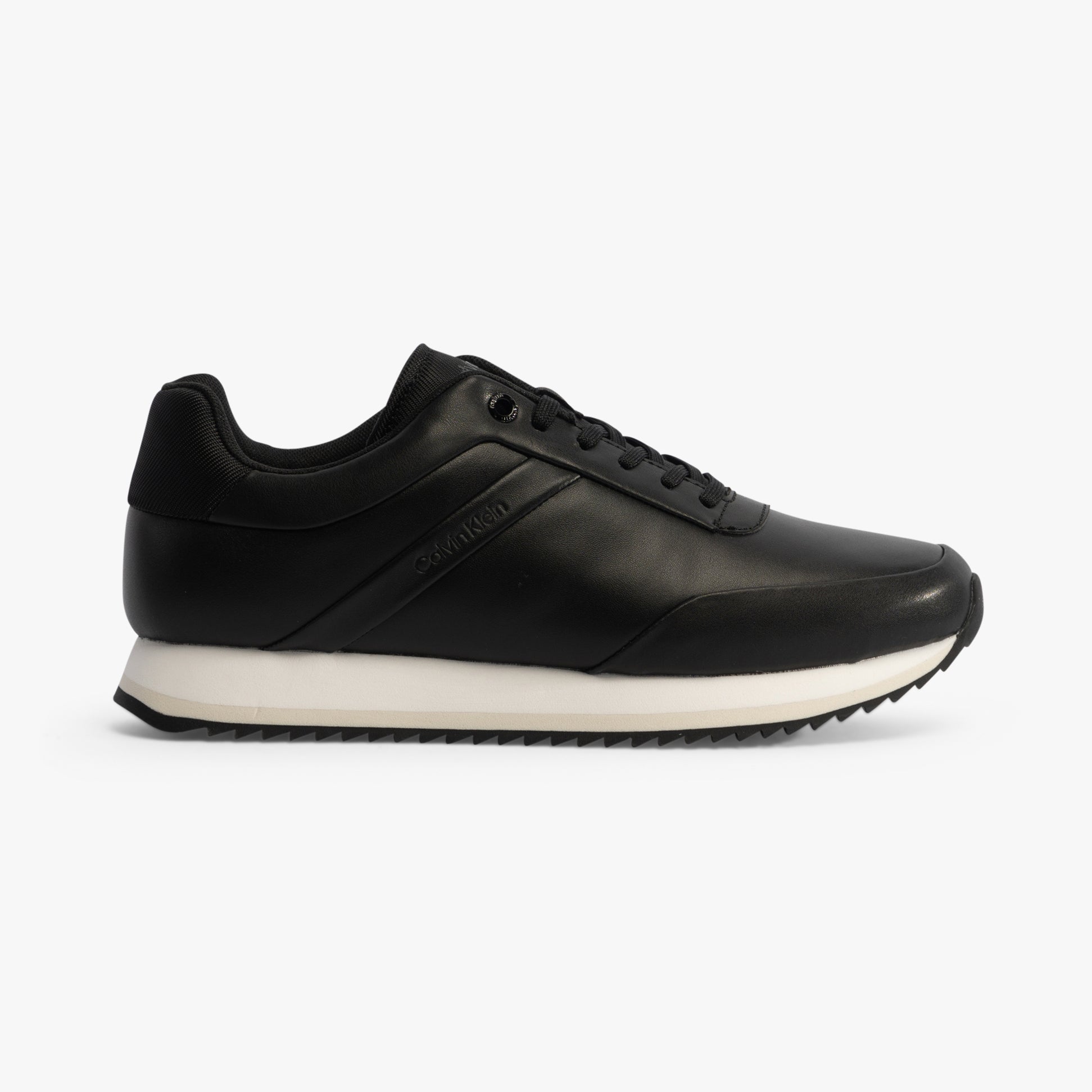 Calvin Klein RUNNER LACE UP Womens Trainers Ck Black side view with leather upper and rubber sole, featuring a lace-up closure.