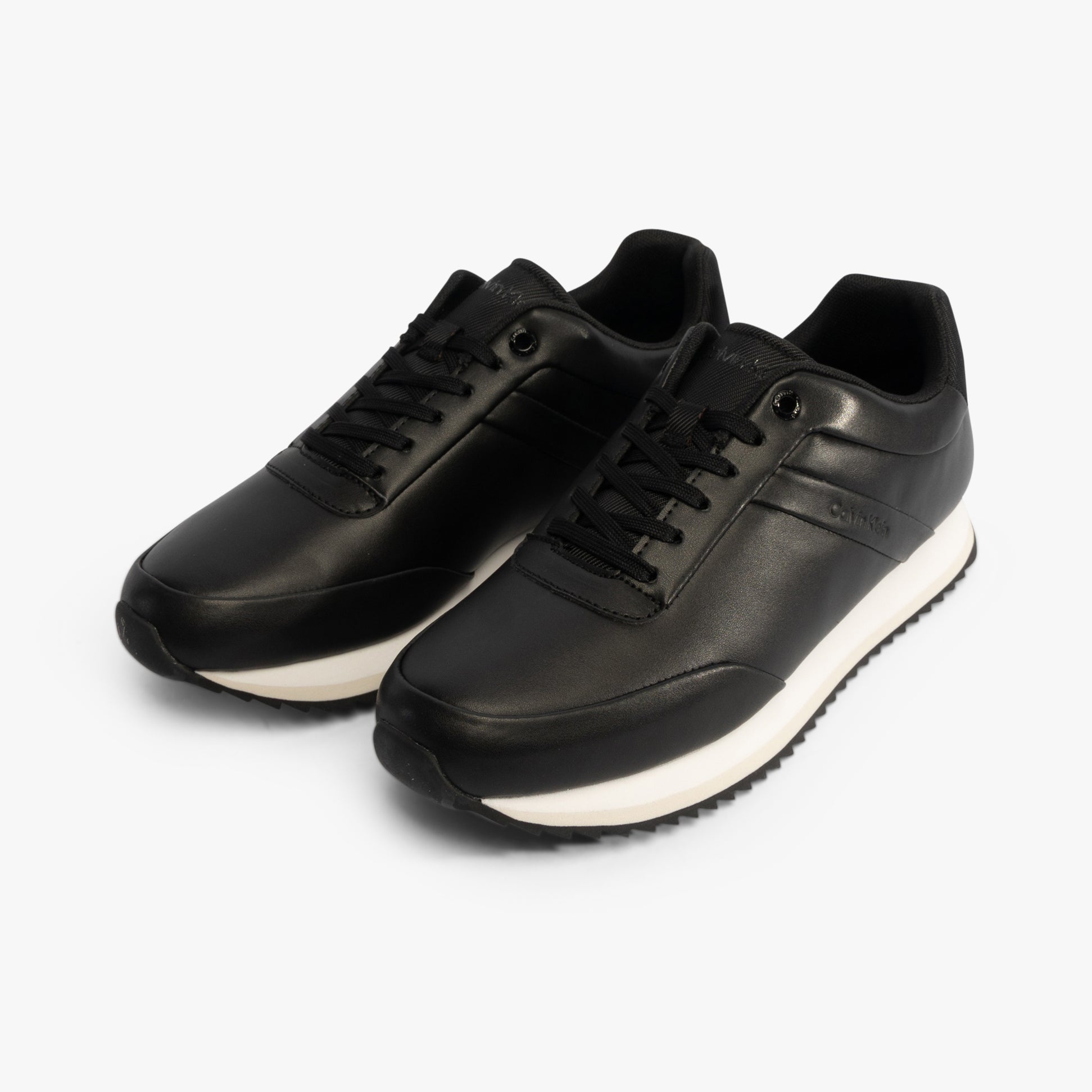 Calvin Klein RUNNER LACE UP Womens Trainers Ck Black, side view showcasing sleek leather upper and lace-up design.