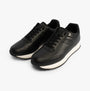 Calvin Klein RUNNER LACE UP Womens Trainers Ck Black, side view showcasing sleek leather upper and lace-up design.