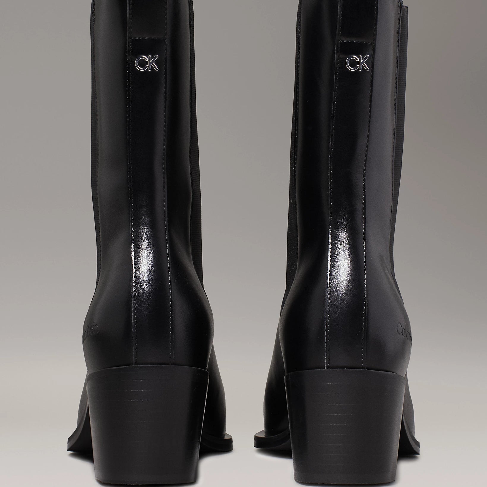 Calvin Klein HEEL Womens Cowboy Boots Ck Black rear view showcasing polished leather and block heels.