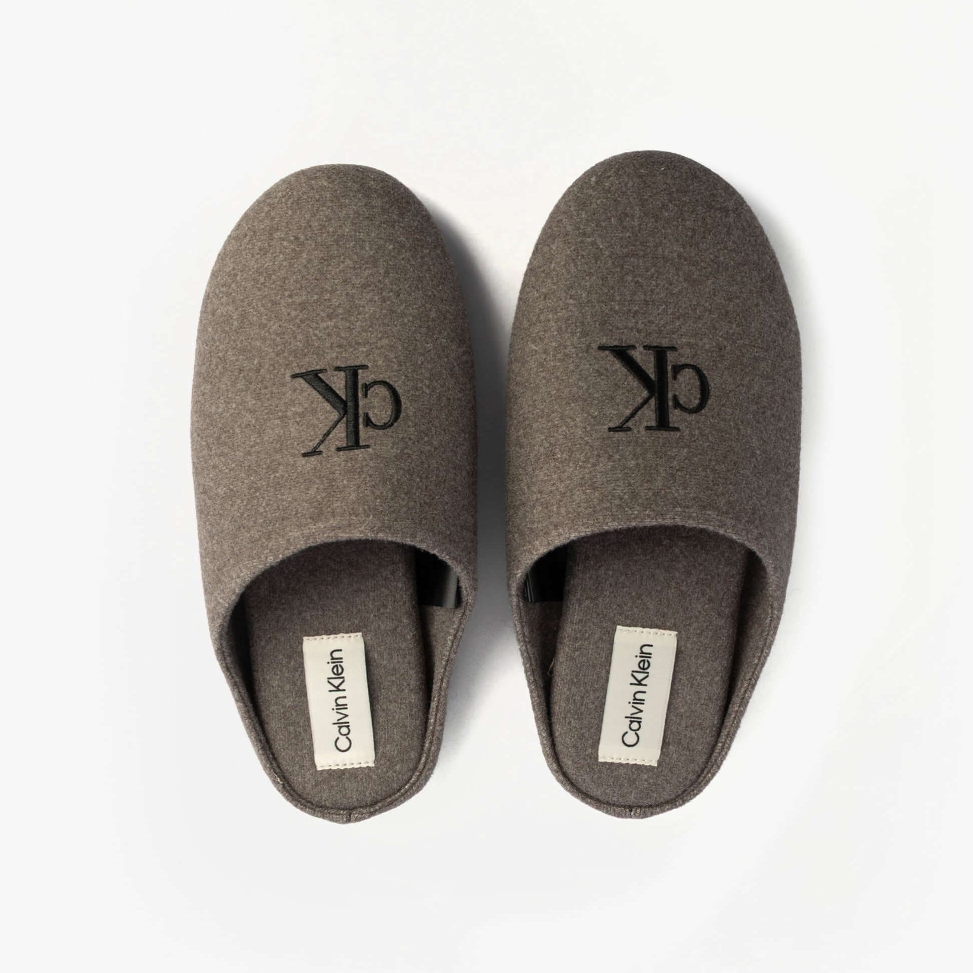 Calvin Klein Mens HOME Felt Signature Logo Mule Slippers Grey top view showcasing logo and felt texture.
