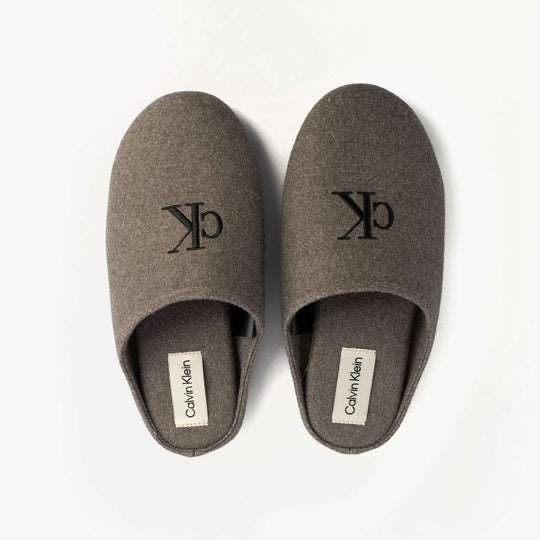 Calvin Klein Mens HOME Felt Signature Logo Mule Slippers Grey top view showcasing logo and felt texture.