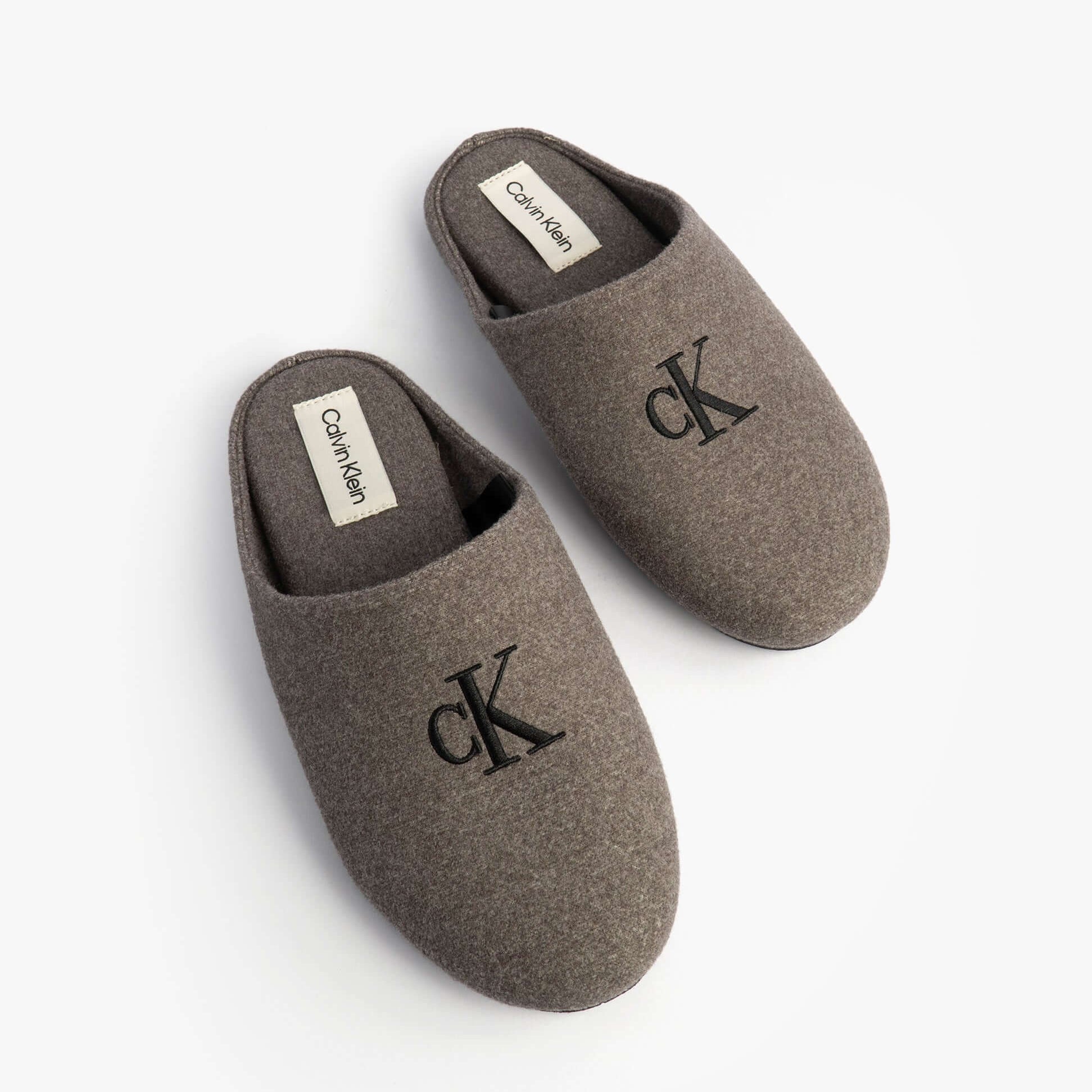 Calvin Klein Mens HOME Felt Signature Logo Mule Slippers Grey top view showing the soft felt material and CK logo.