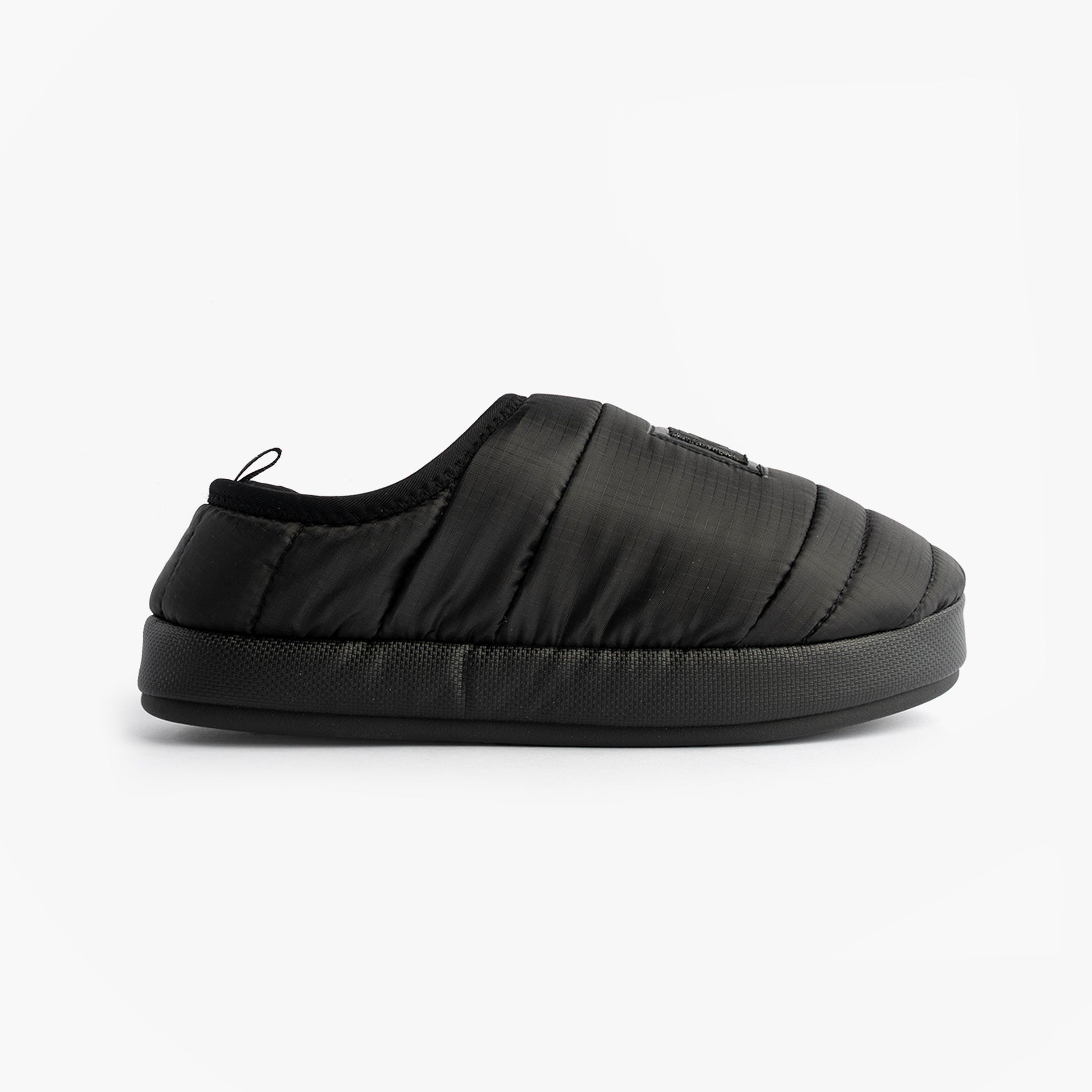 Calvin Klein HOME SLIPPER NYL PAT Womens Slippers Black side view showcasing soft polyester upper and lightweight design.