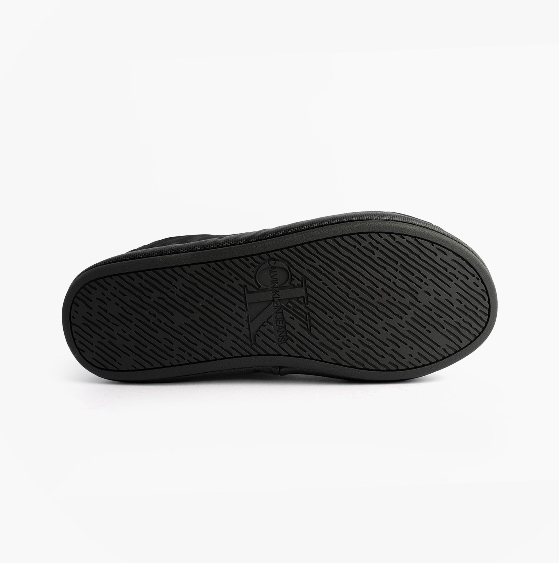 Calvin Klein HOME SLIPPER NYL PAT Womens Slippers Black bottom view showing the textured sole design.