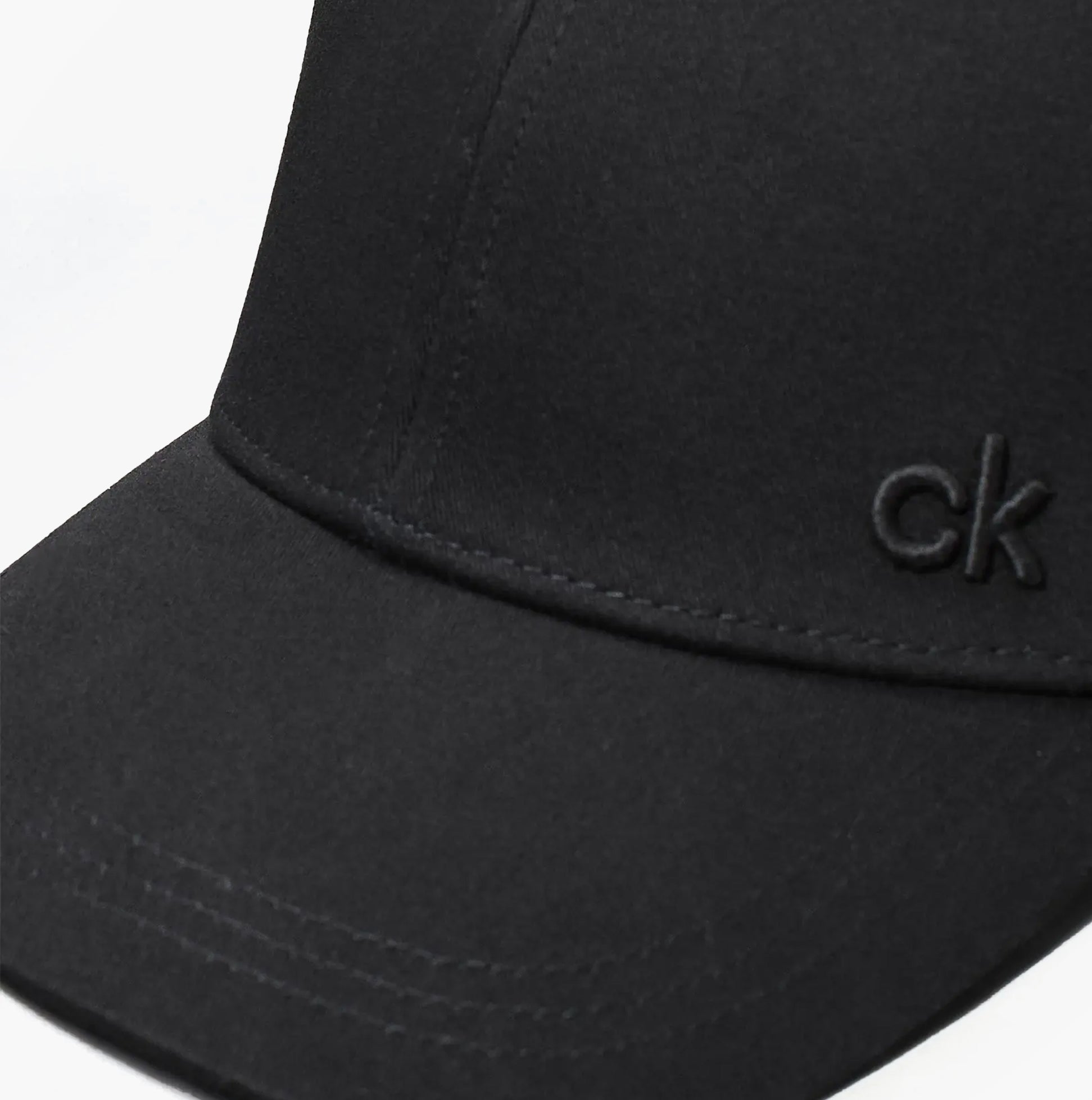 Calvin Klein Mens BASEBALL CAP Black detail view showcasing the black fabric and logo embroidery.