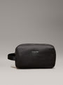 Calvin Klein WARMTH WASHBAG Mens Black front view with zip closure, lightweight faux leather exterior and side handle.