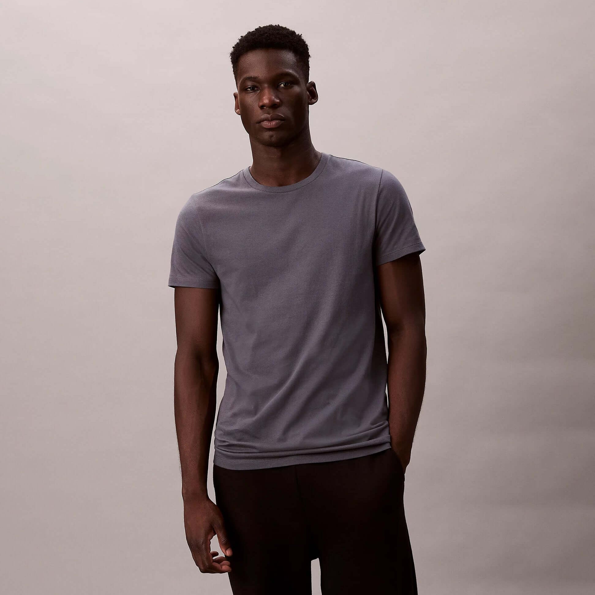 Calvin Klein S/S CREW NECK 3 PACK Mens T-Shirts & Tank Tops Multicoloured front view of model wearing grey t-shirt.