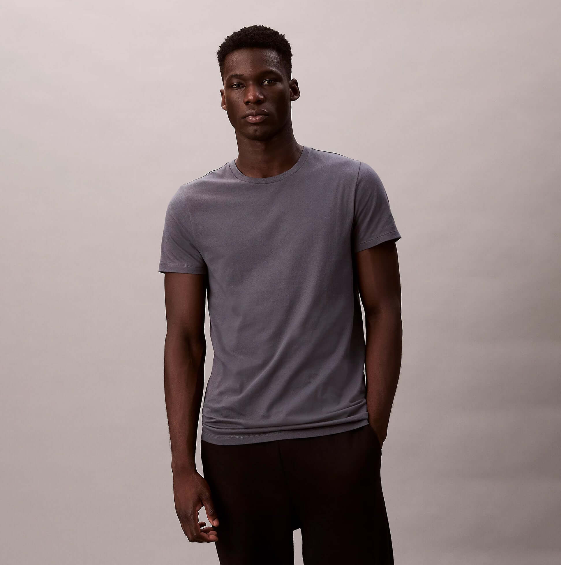 Calvin Klein S/S CREW NECK 3 PACK Mens T-Shirts & Tank Tops Multicoloured front view of model wearing grey t-shirt.