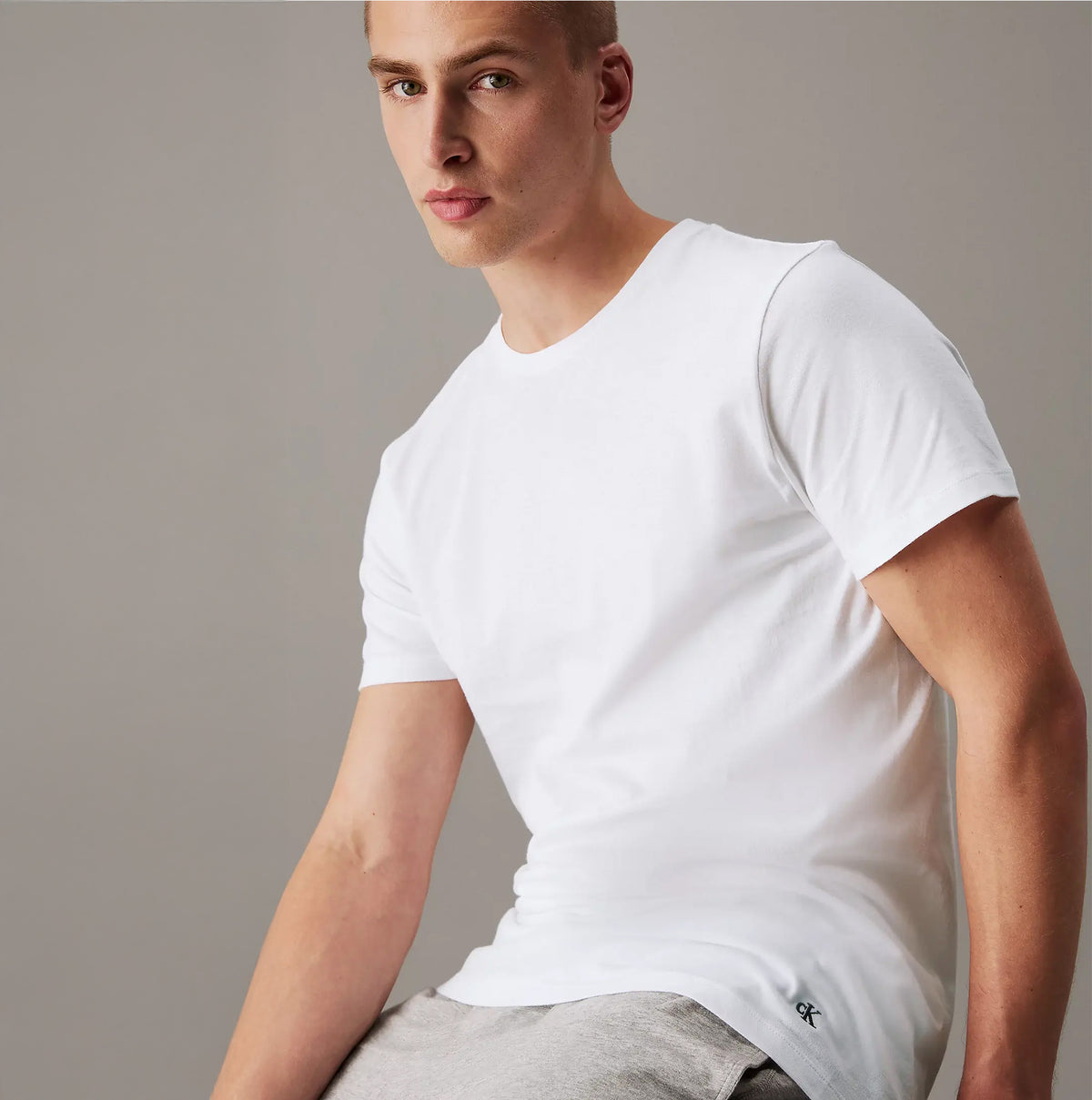 Calvin Klein 100% COTTON 3 Pack Mens T-Shirts White front view on model showcasing short sleeves and crew neckline.