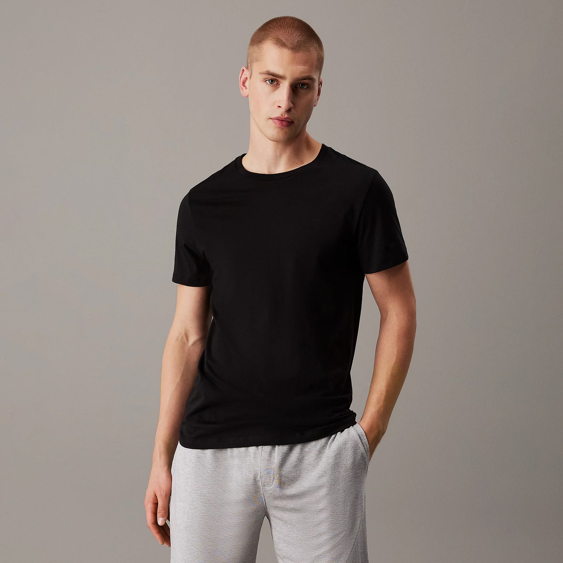 Calvin Klein 100% COTTON 3 Pack Mens T-Shirts Black/Grey Heather/White front view of black crew neck t-shirt on male model.