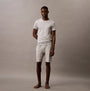 Calvin Klein 100% COTTON 3 Pack Mens T-Shirts Black/Grey Heather/Glacier front view of model wearing grey t-shirt and shorts.