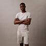 Calvin Klein 100% COTTON 3 Pack Mens T-Shirts Black/Grey Heather/Glacier front view model wearing heather grey t-shirt and shorts.
