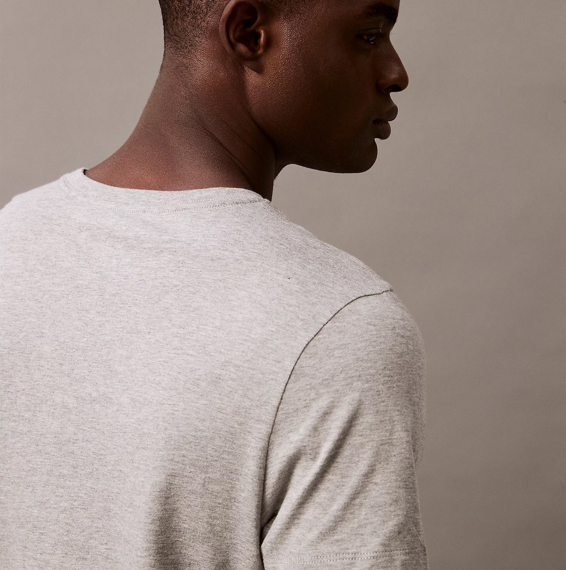 Calvin Klein 100% COTTON 3 Pack Mens T-Shirts Black/Grey Heather/Glacier back view on model showing grey heather fabric.