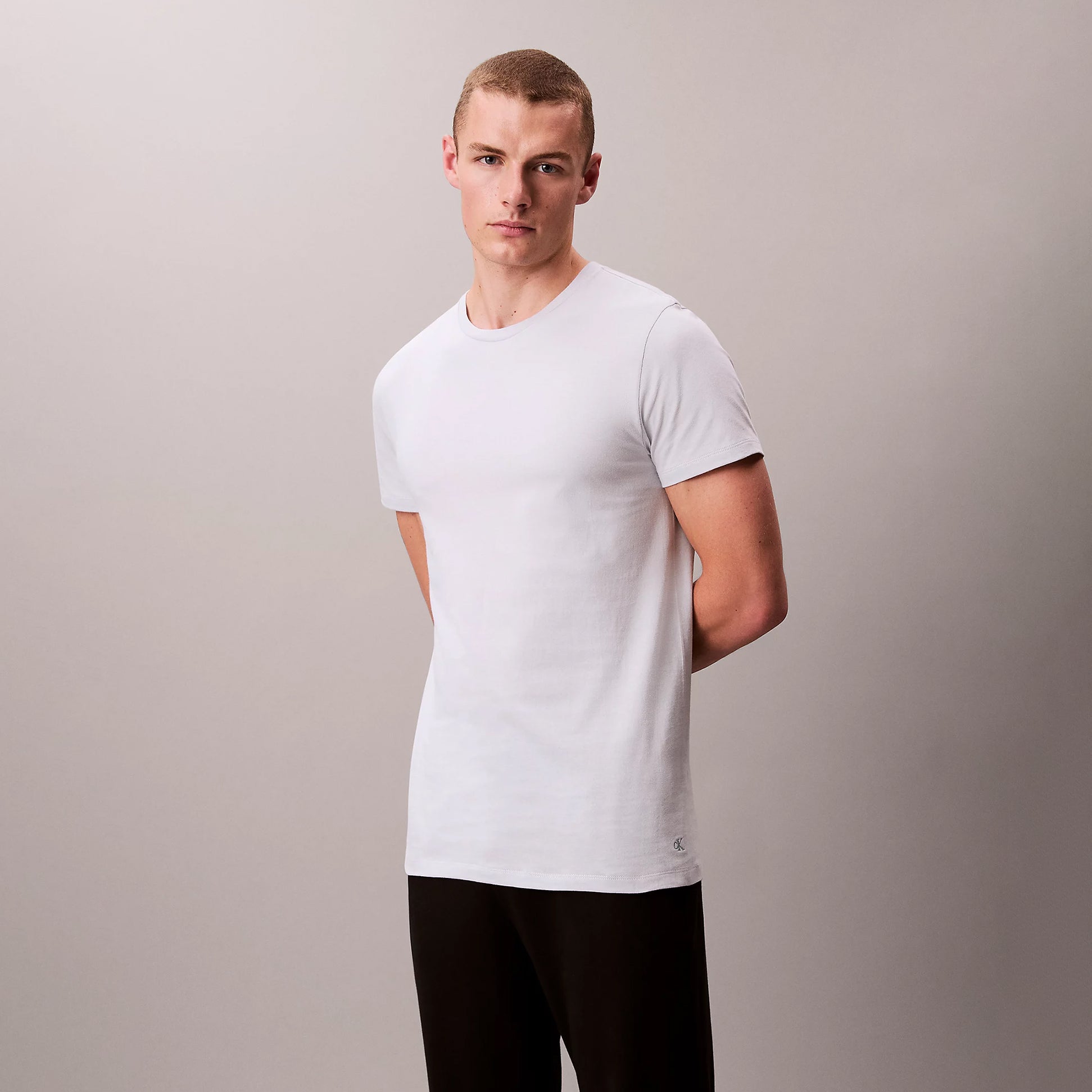 Calvin Klein 100% COTTON 3 Pack Mens T-Shirts Shoreline front view, featuring a model in a white short sleeve shirt.