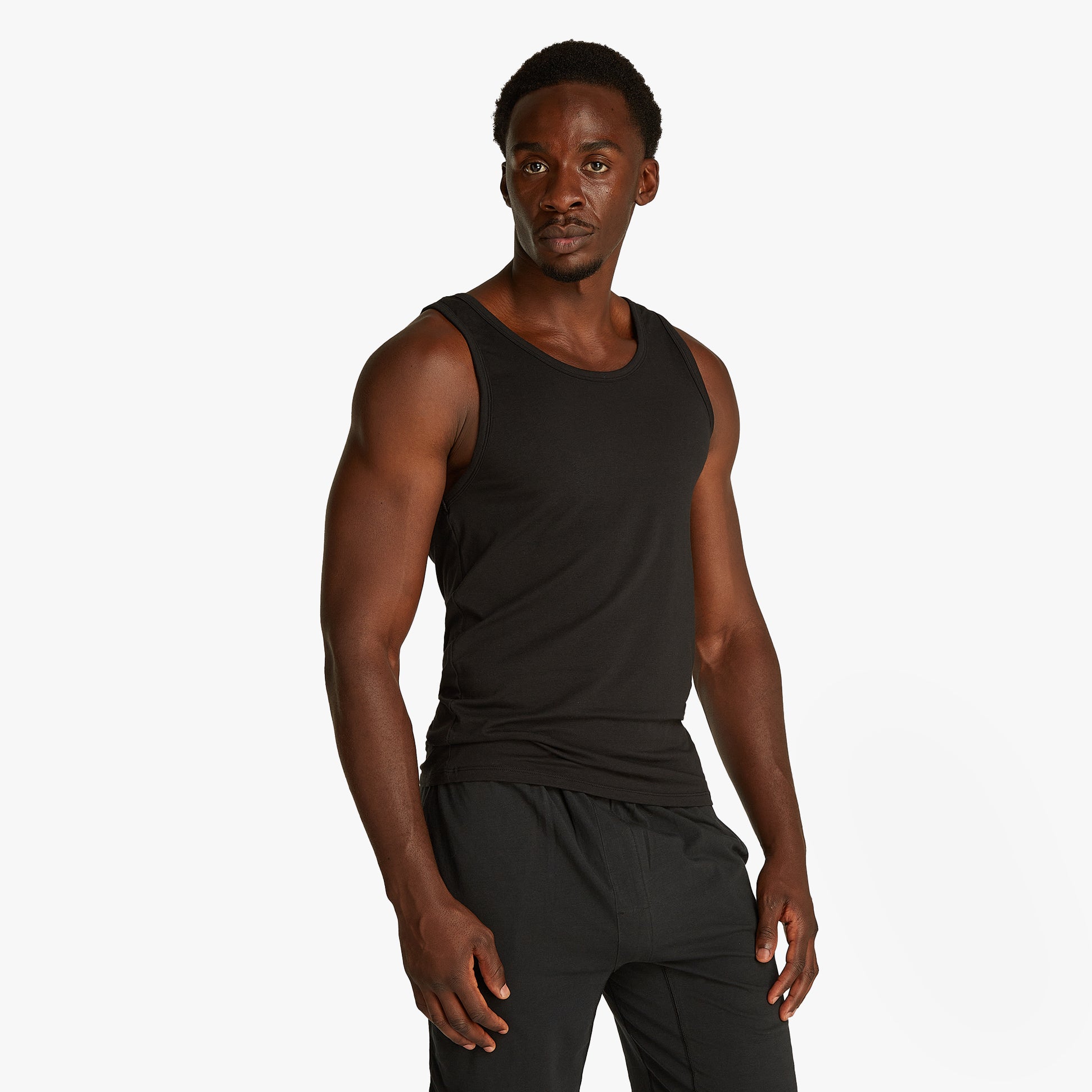 Calvin Klein 3 Pack Mens Lounge Tank Tops Black side view model wearing sleeveless black tank top.