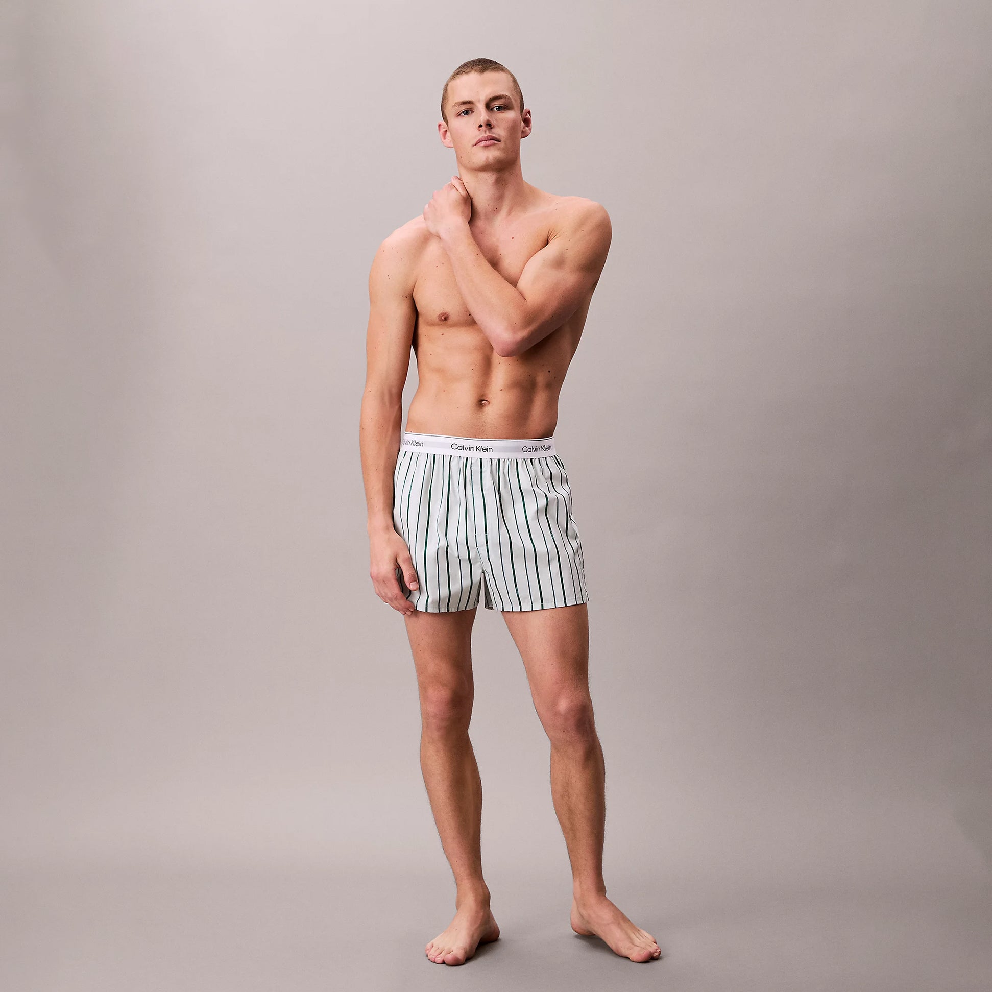 Calvin Klein BOXER SLIM 3 Pack Mens Cotton Stretch Multicoloured front view model wearing striped boxers.
