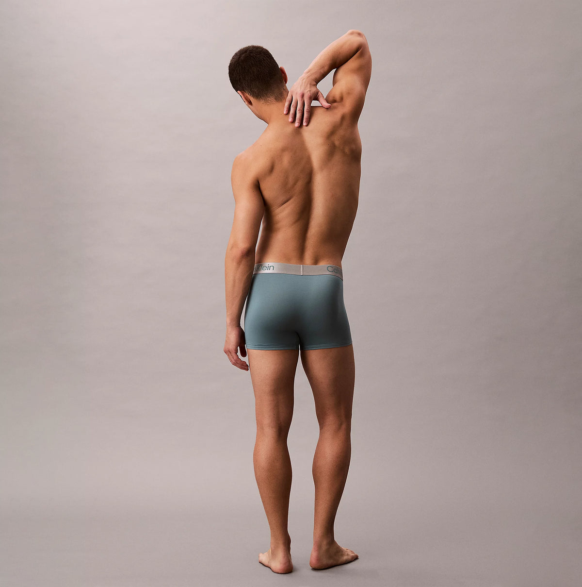 Calvin Klein TRUNK 3 Pack Mens Micro Stretch Multicoloured back view of model wearing grey trunk underwear.