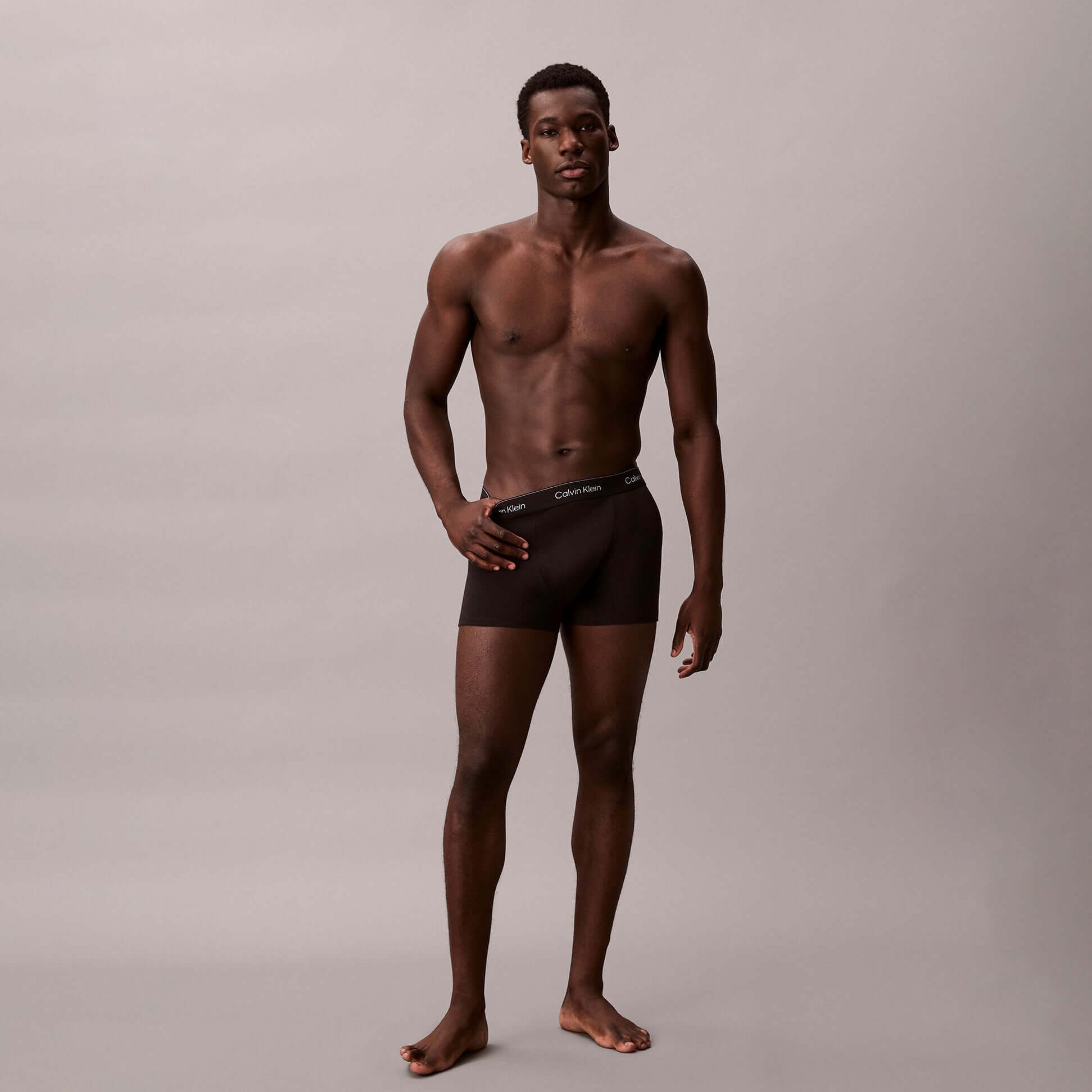 Calvin Klein RELAXED FIT Mens 3 Pack Trunks Multicoloured front view on model, showcasing comfortable fit and styling.