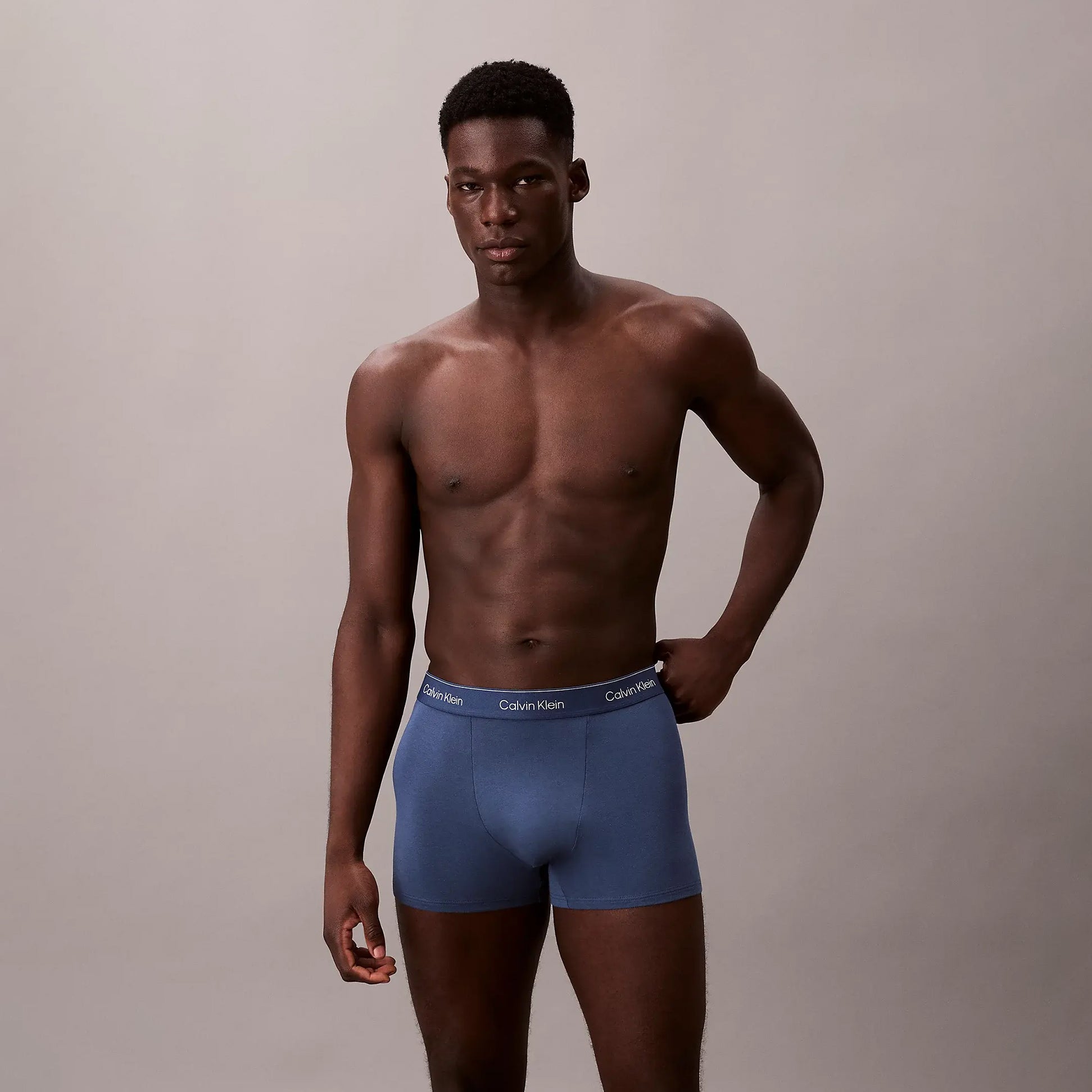 Calvin Klein RELAXED FIT 3 Pack Mens Trunks Multicolour front view on model wearing blue trunks.