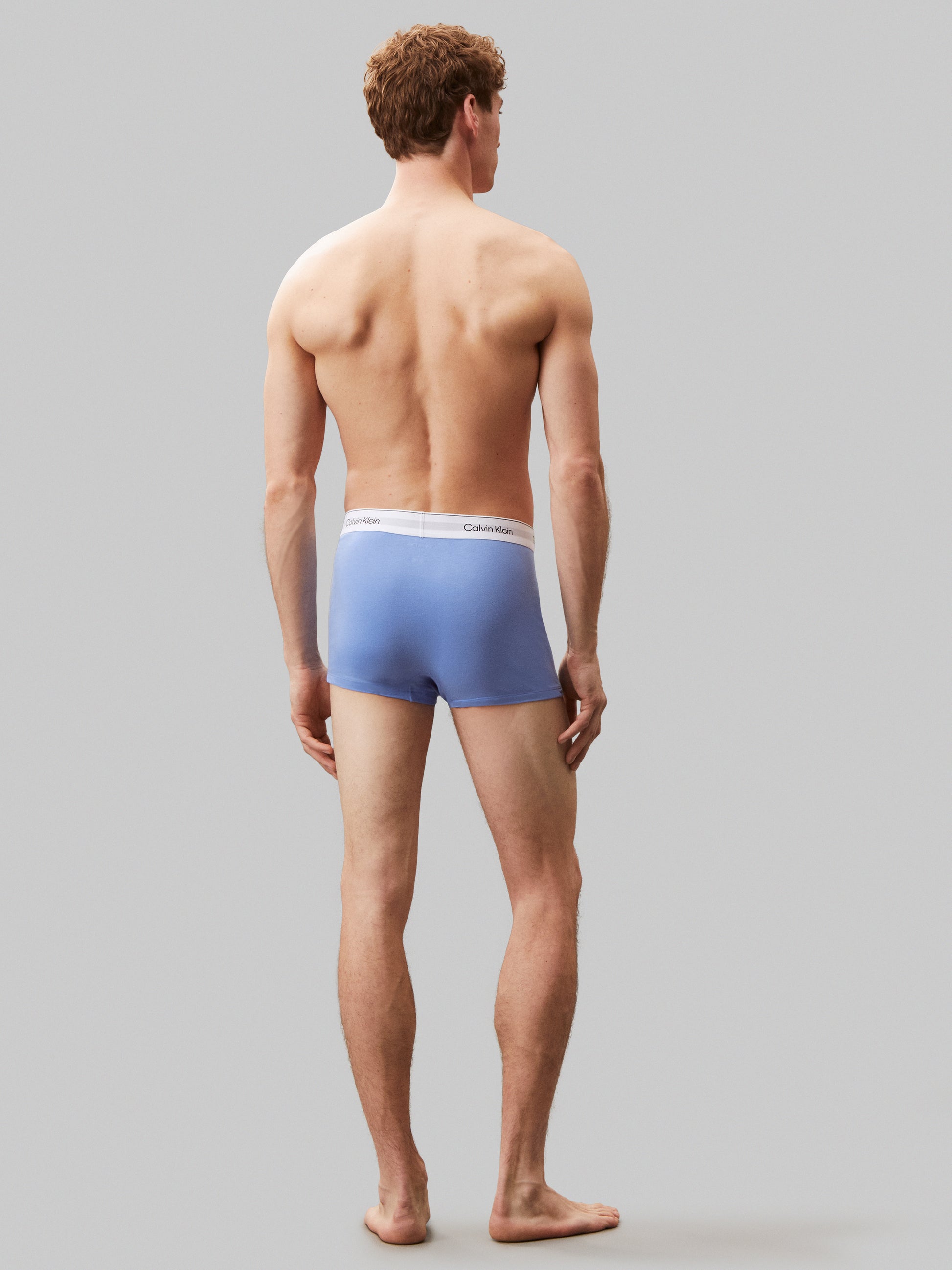 Calvin Klein ICON COTTON STRETCH 3 Pack Mens Dart Trunks Multicoloured back view on model, showcasing blue trunk design and signature waistband.