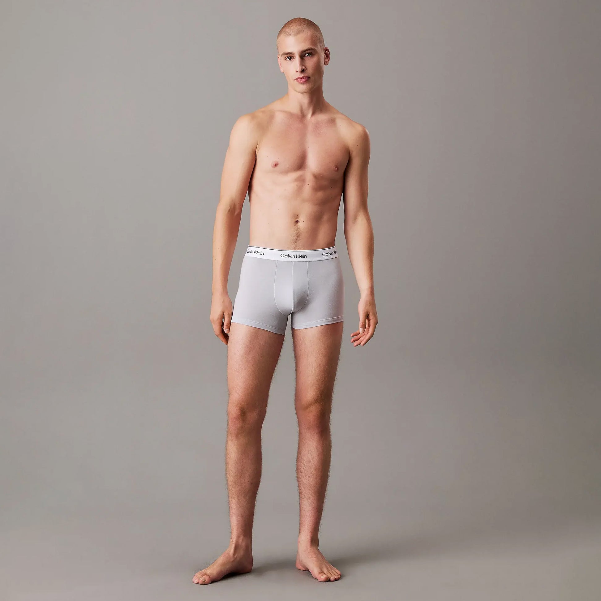 Calvin Klein TRUNK 3 Pack Mens Multicoloured front view model wearing grey trunks with logo waistband.